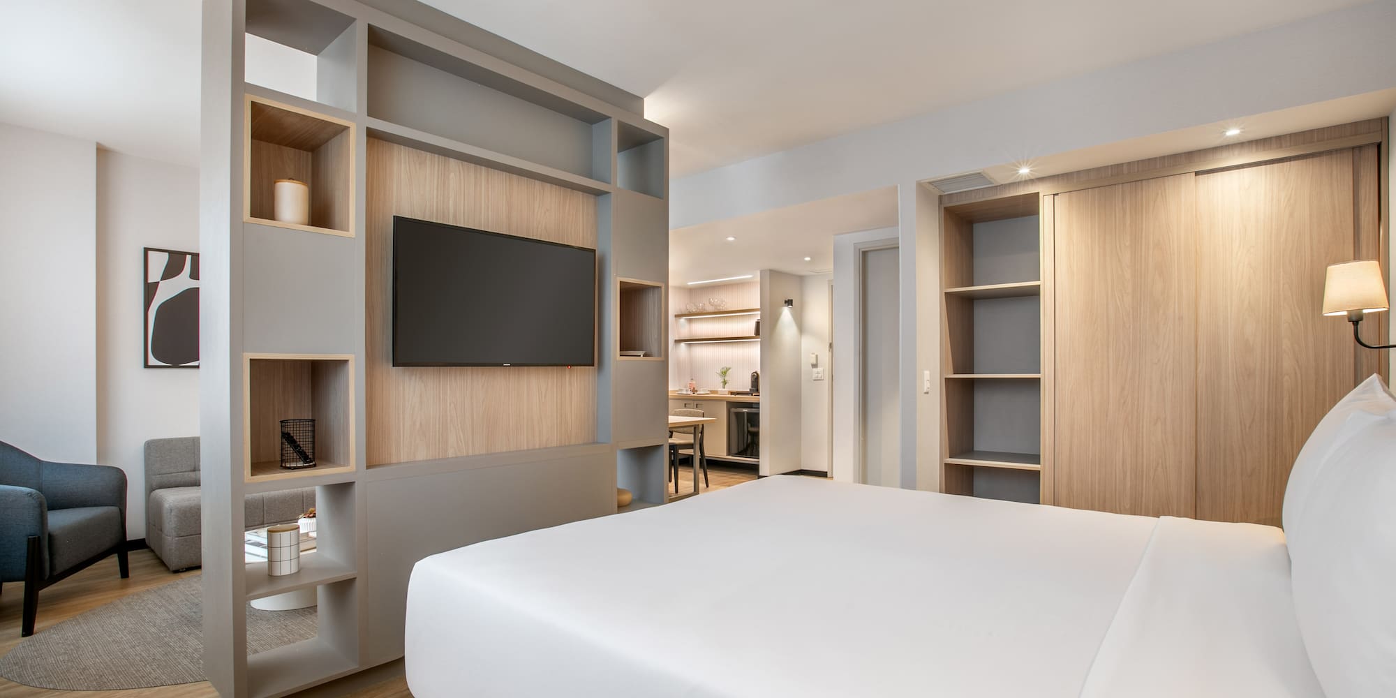 a room with a bed and shelves