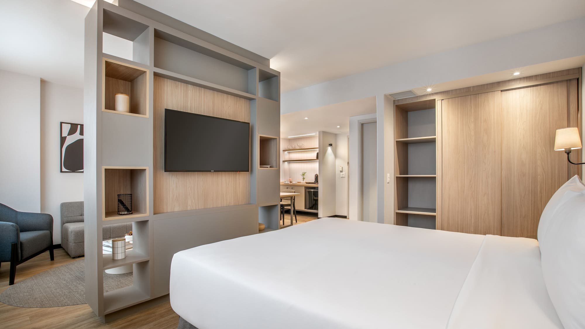 a room with a bed and shelves