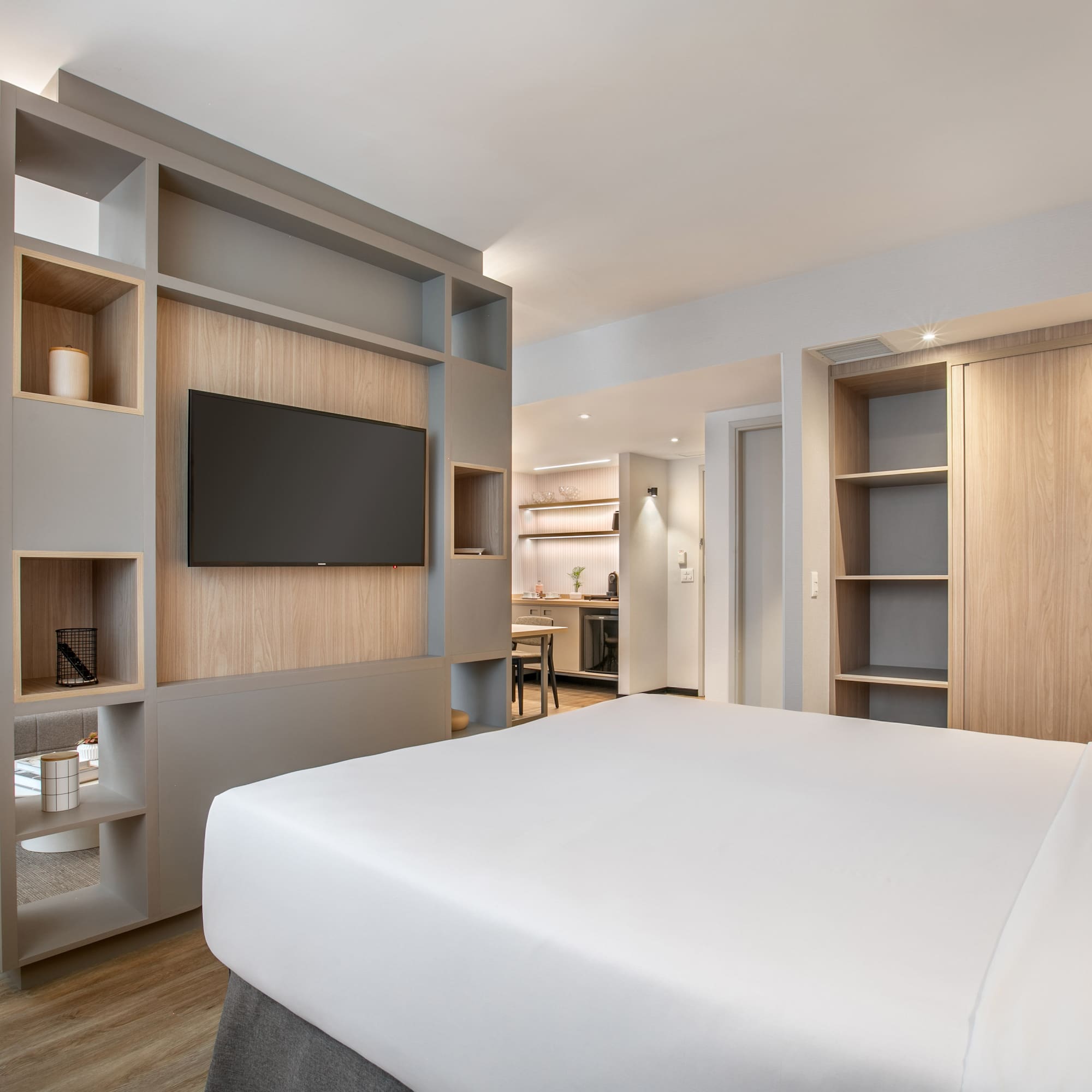 a room with a bed and shelves