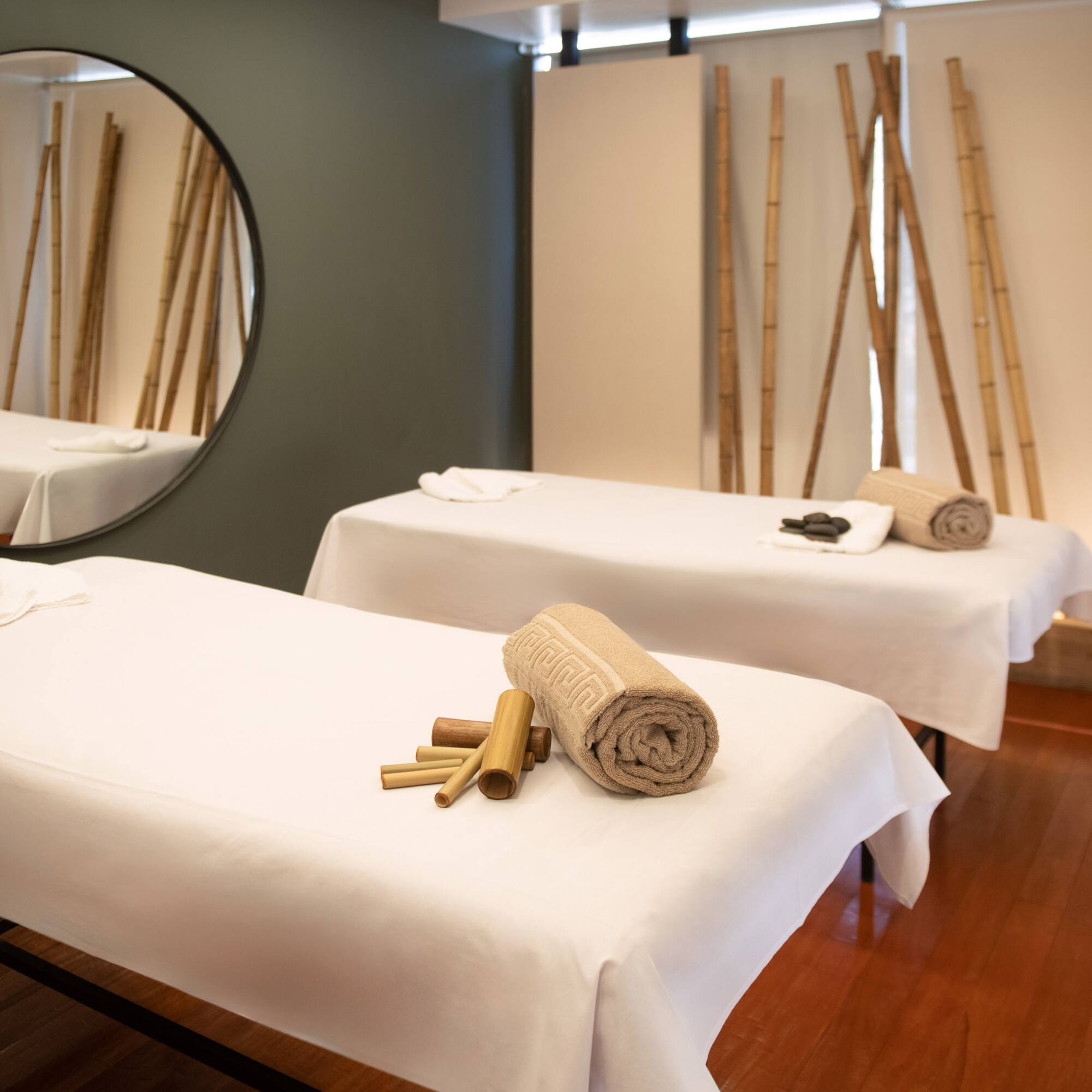 a indoor pool with a large tub and chairs