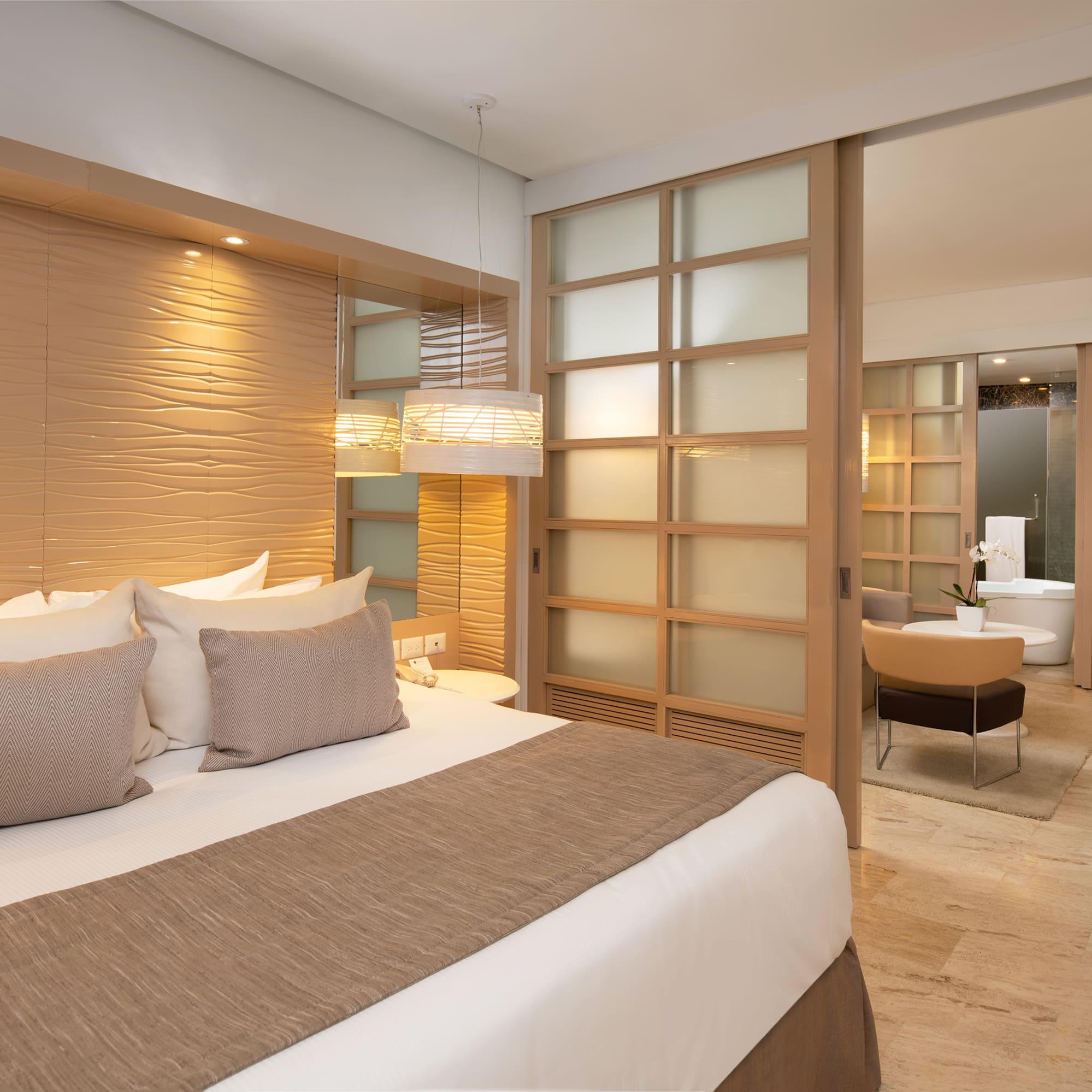 a bedroom with a bed and a bathtub