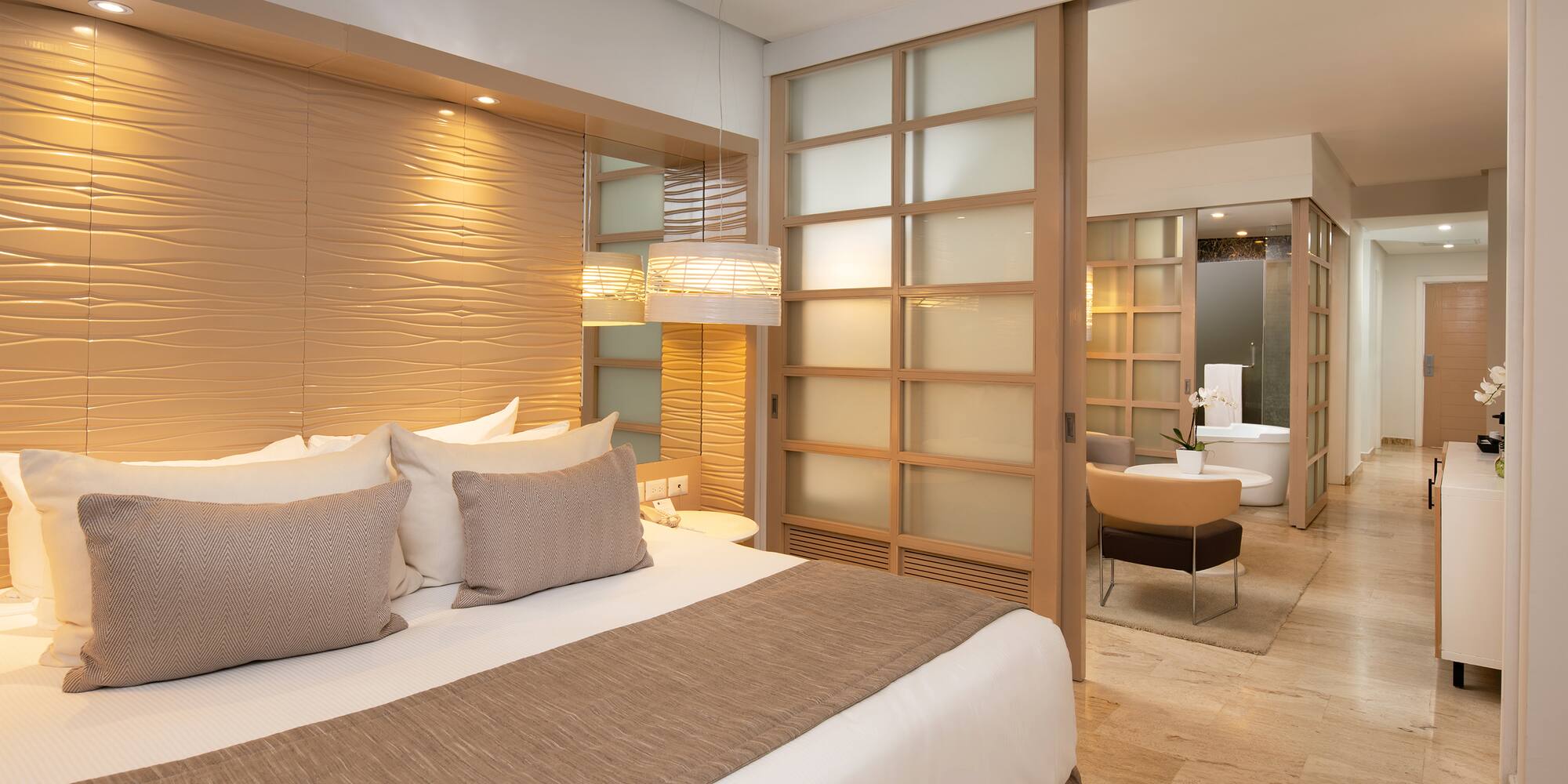 a bedroom with a bed and a bathtub