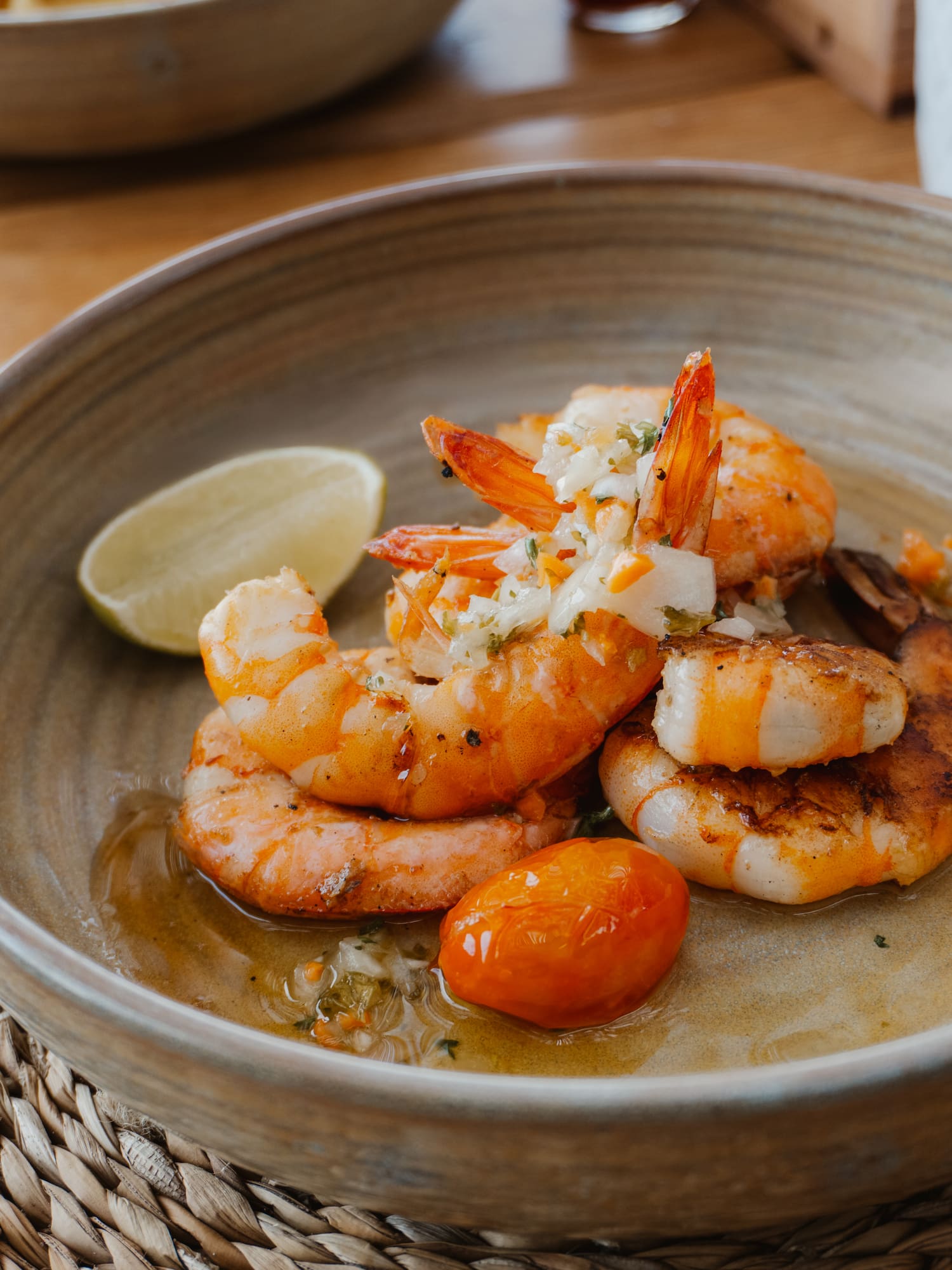 a plate of shrimp and tomatoes