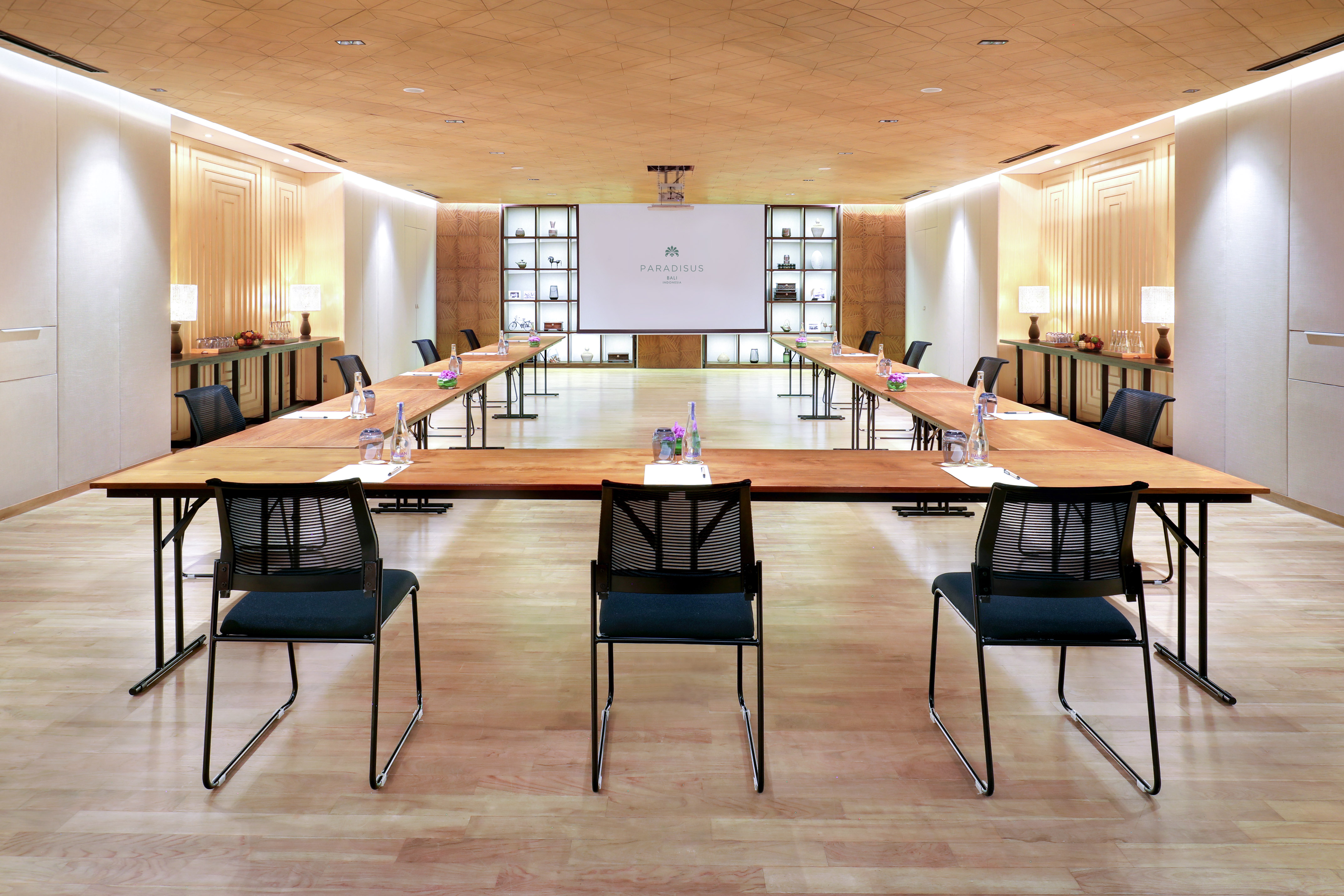 a room with a large table and chairs