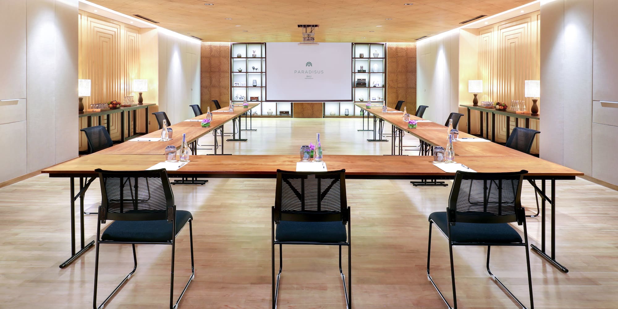 a room with a large table and chairs