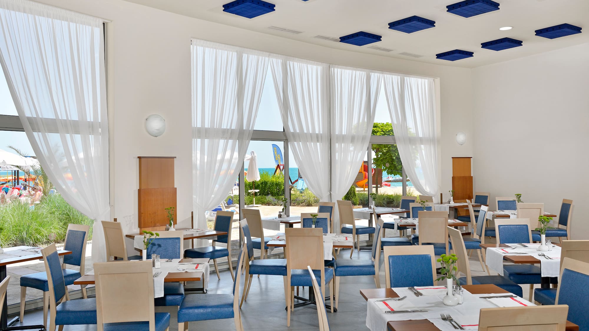 a room with tables and chairs