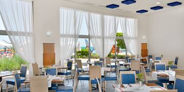 a room with tables and chairs