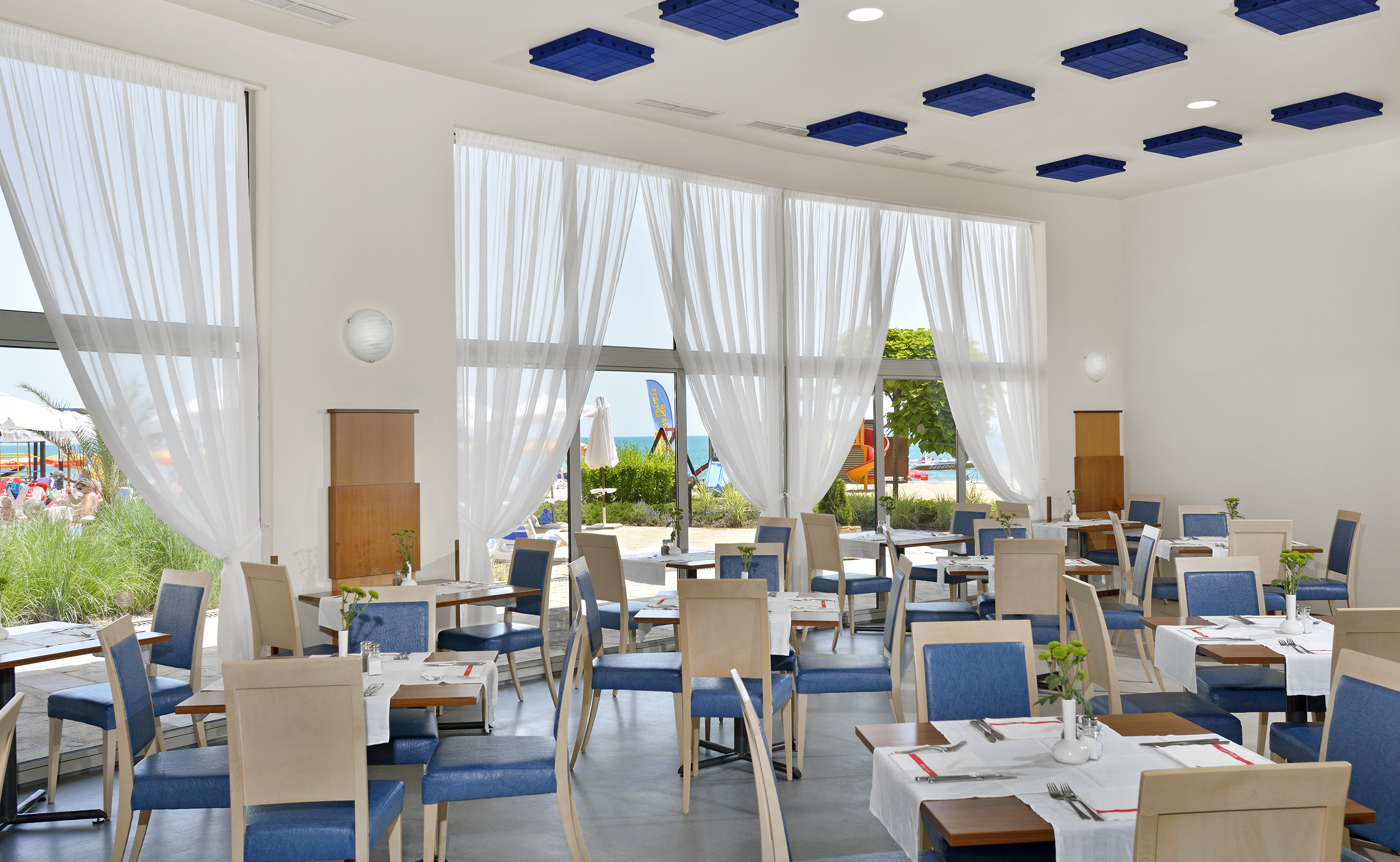 a room with tables and chairs