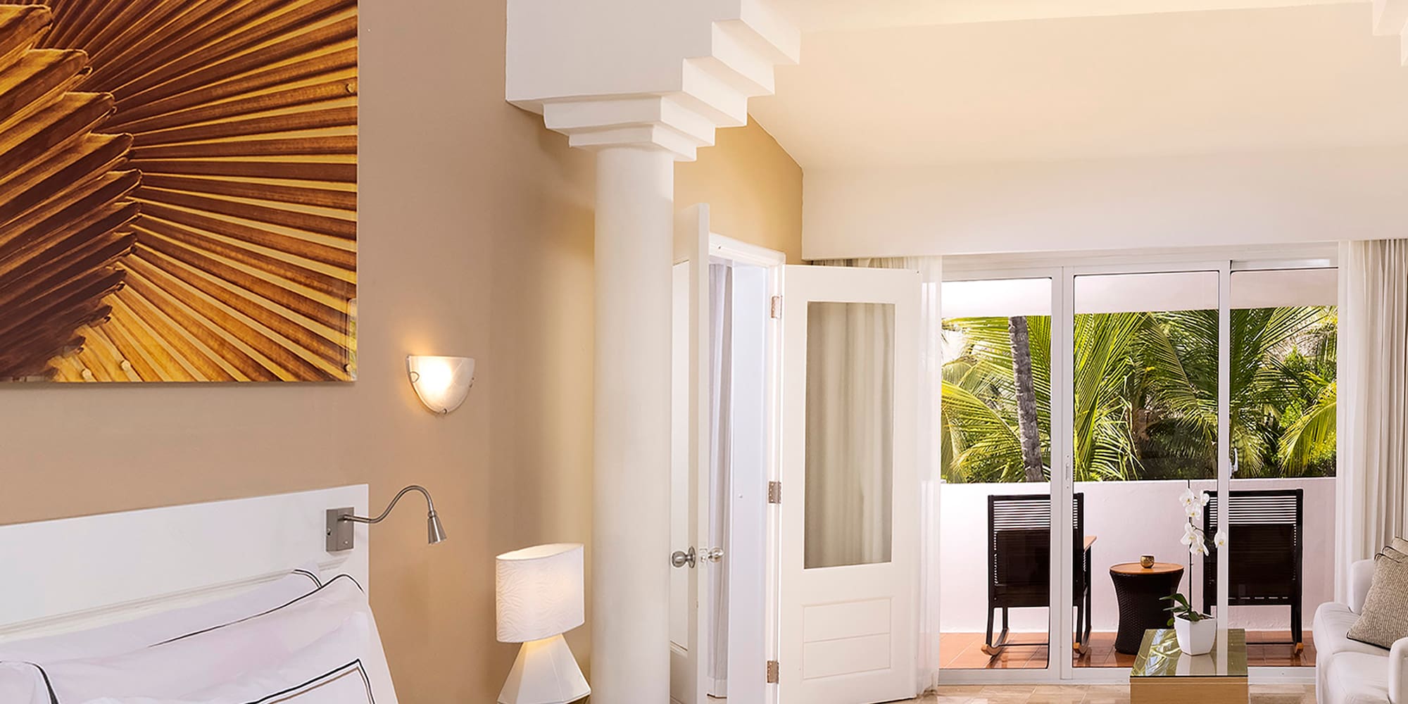 a bedroom with a large bed and a ceiling fan