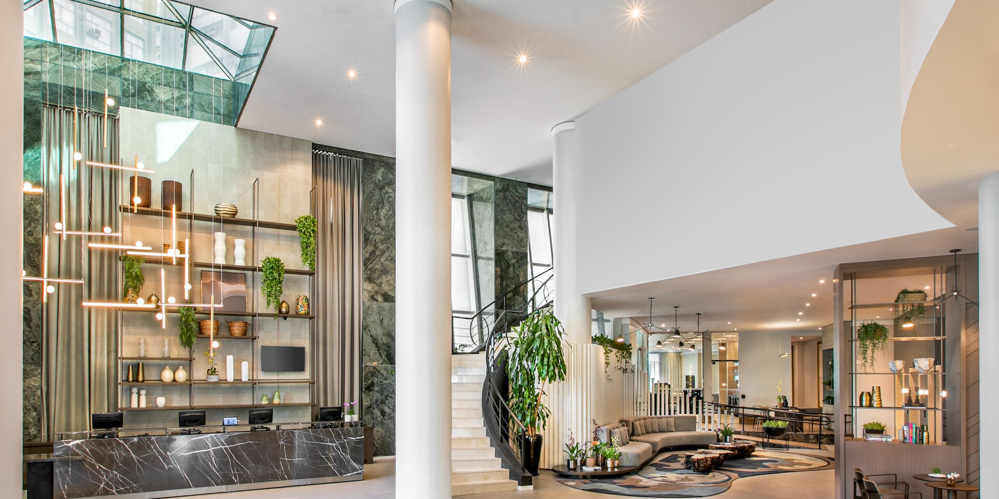 a large room with a staircase and a large wall