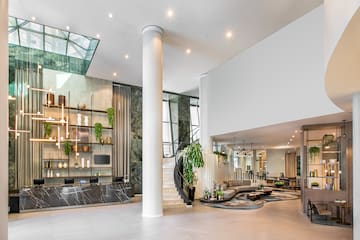 a large room with a staircase and a large wall