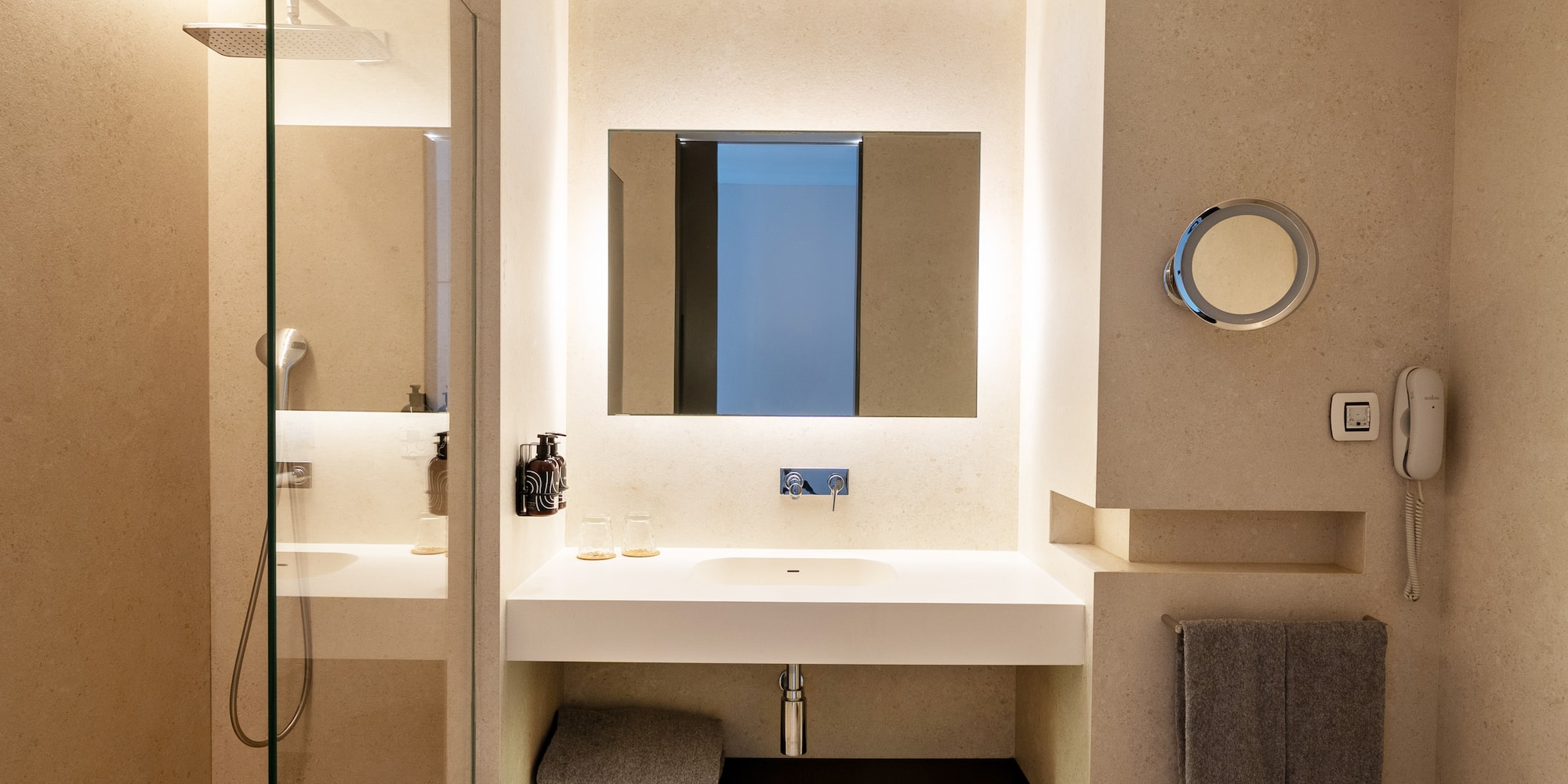 a bathroom with a mirror and a shower