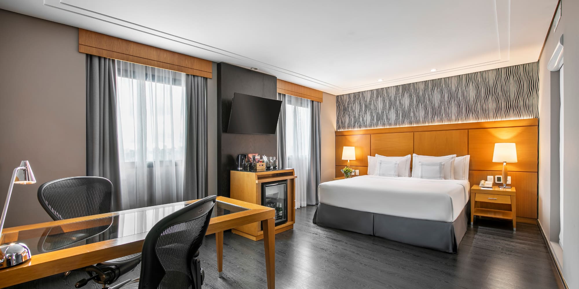 a room with a bed and a desk