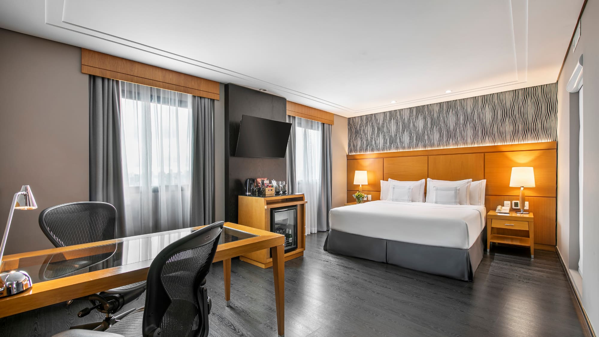 a room with a bed and a desk