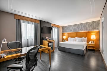 a room with a bed and a desk