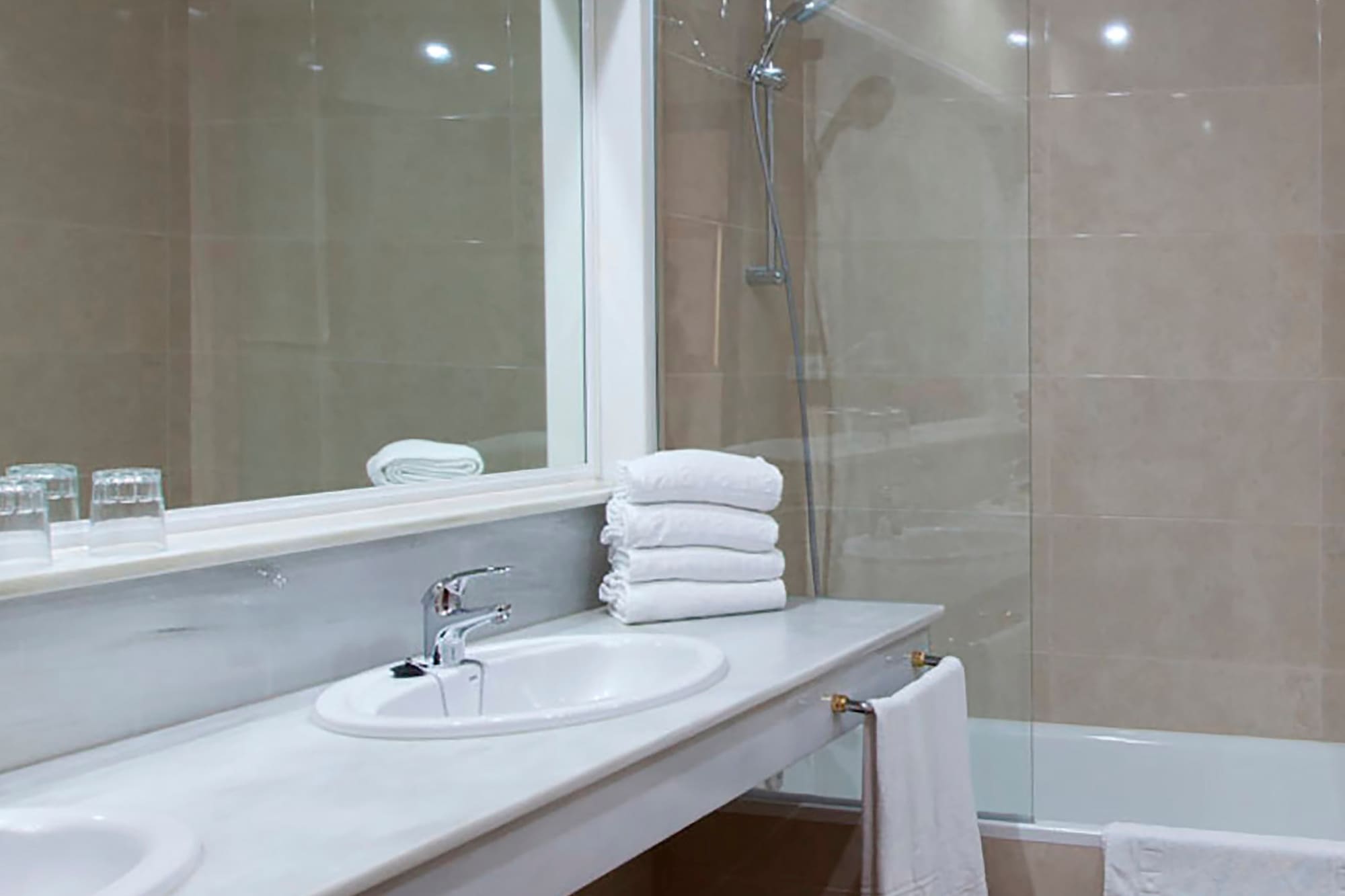 a bathroom with a shower and sink