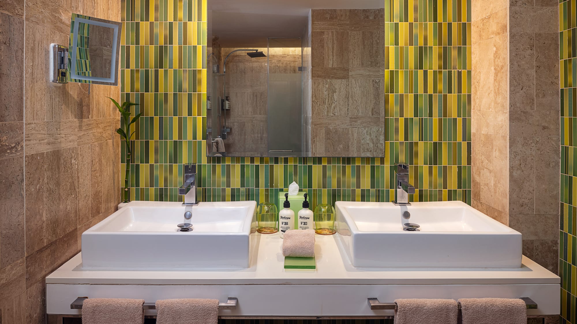 a bathroom with two sinks and a mirror