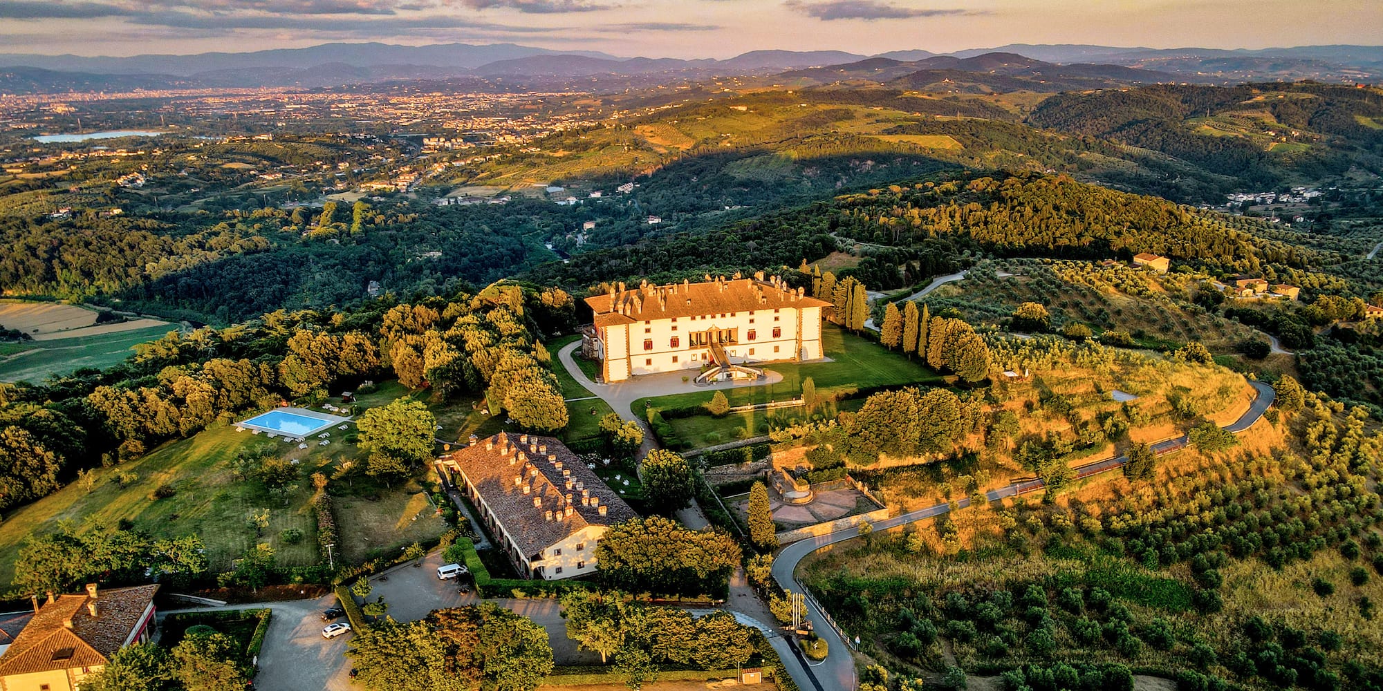 a large house surrounded by trees
