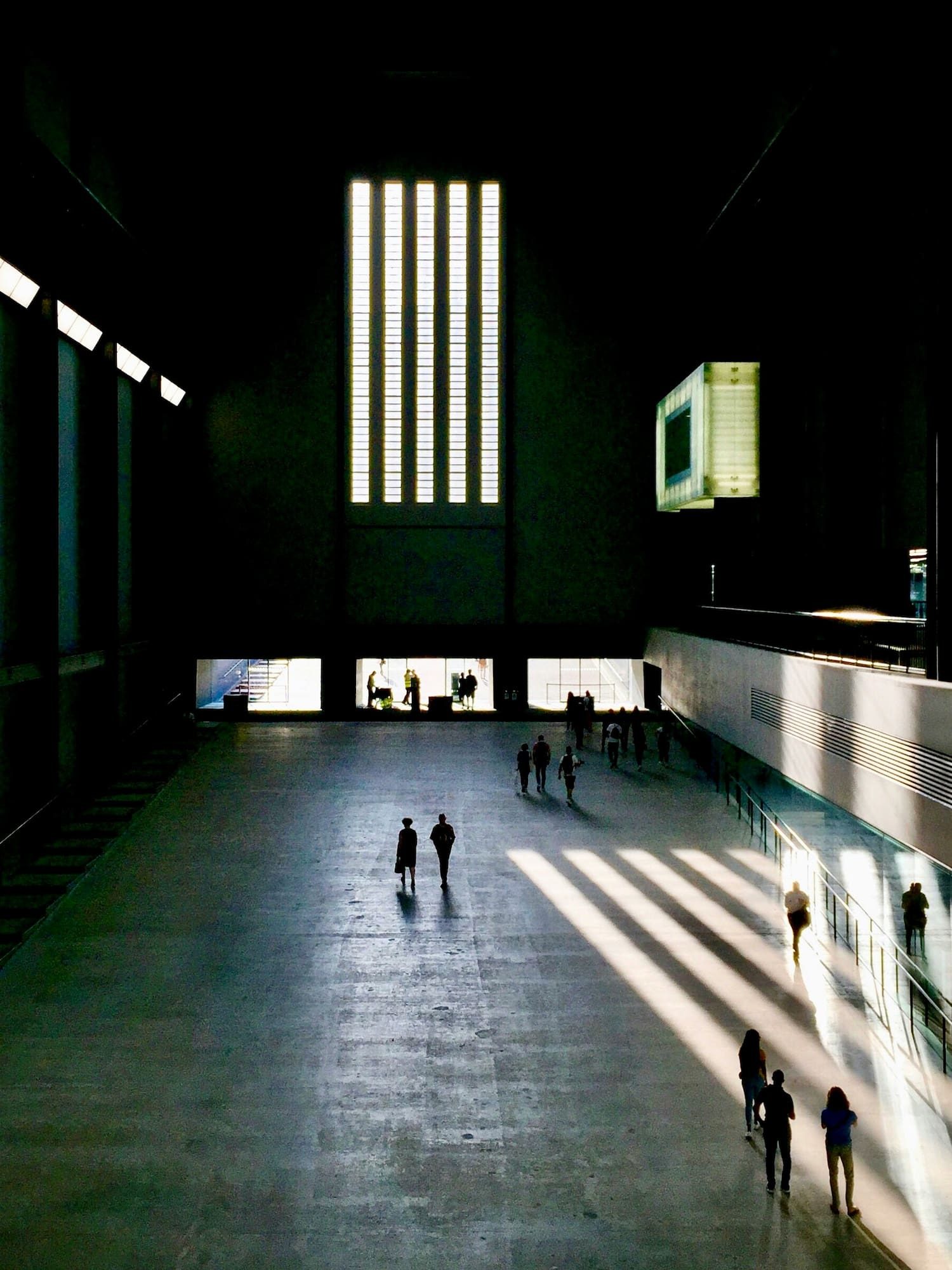 people walking in a large building
