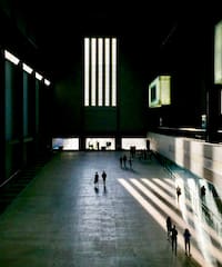people walking in a large building