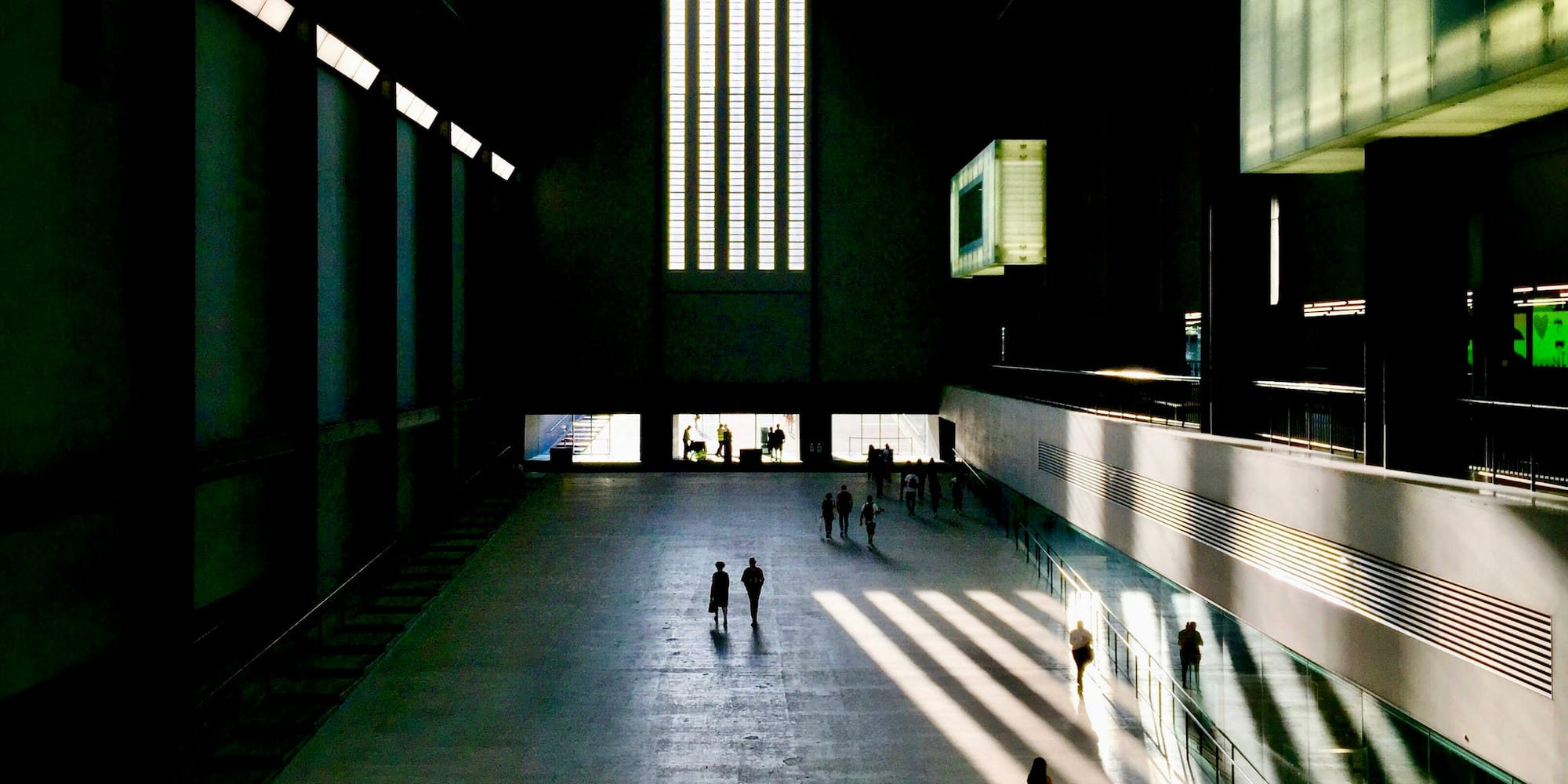 people walking in a large building