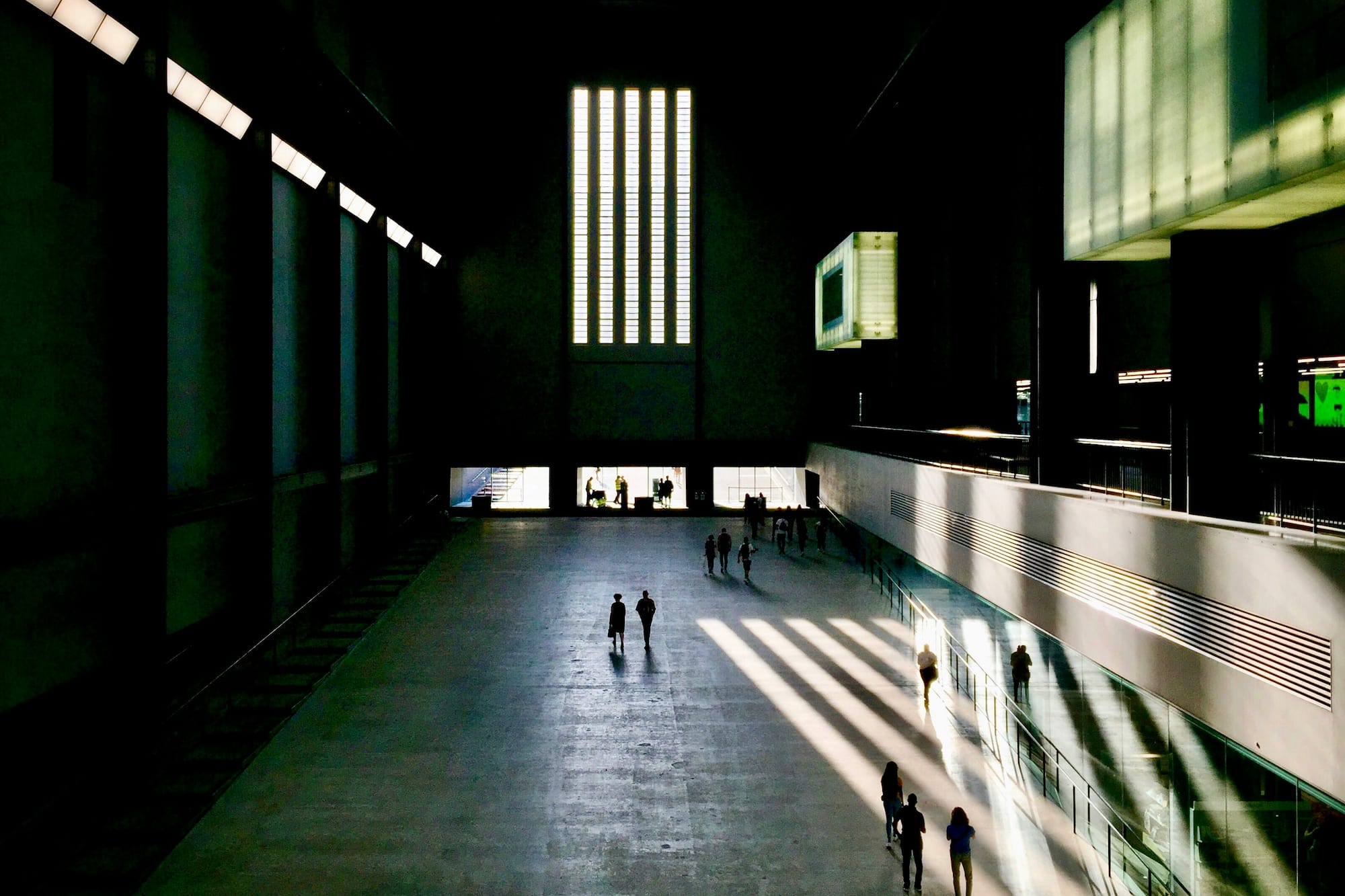 people walking in a large building
