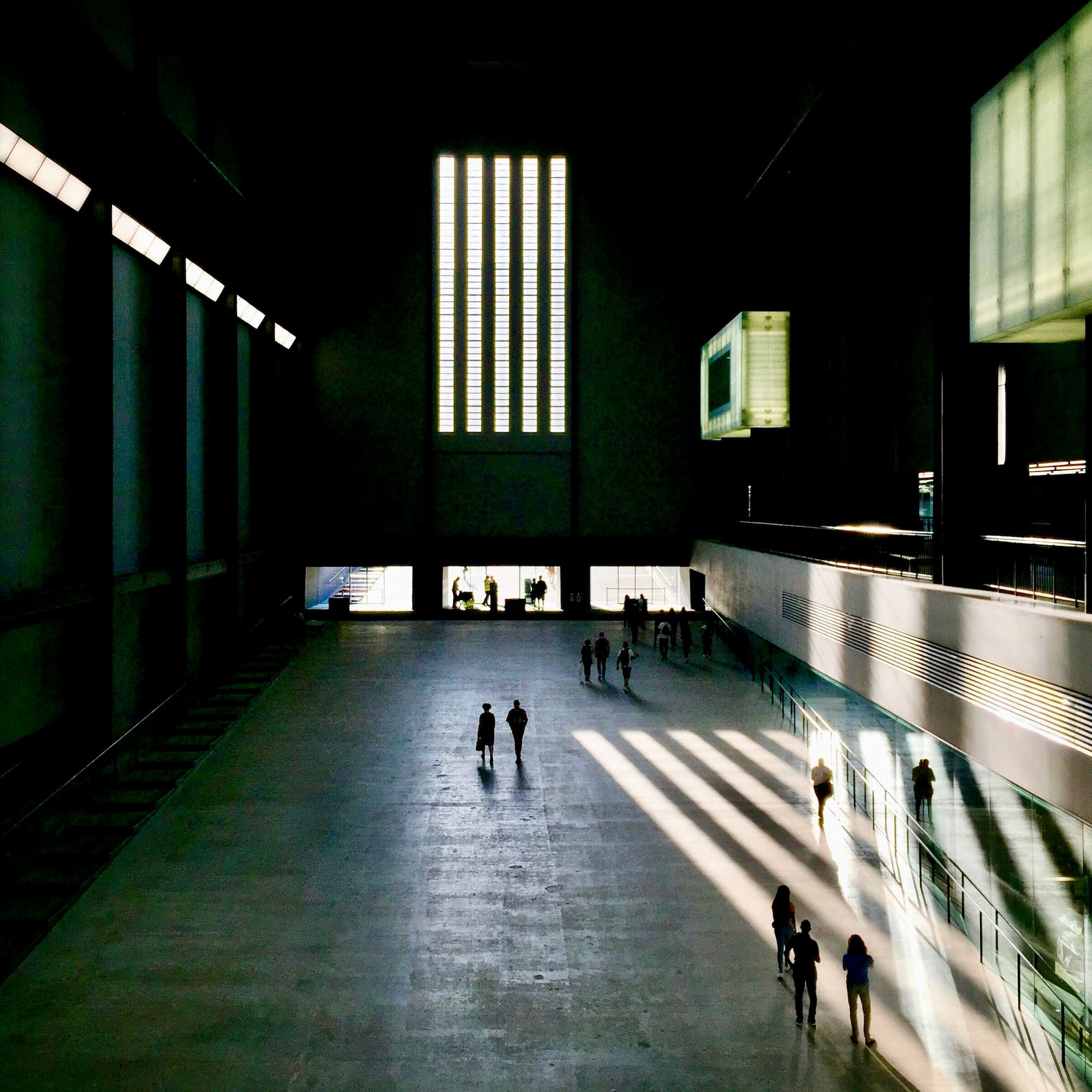 people walking in a large building