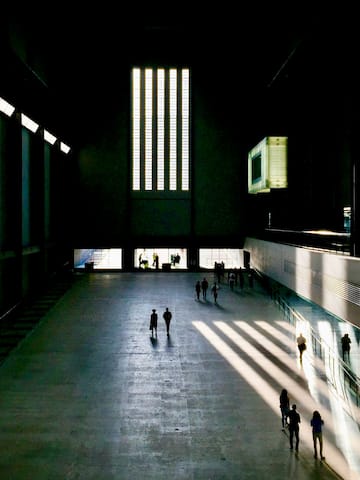 people walking in a large building