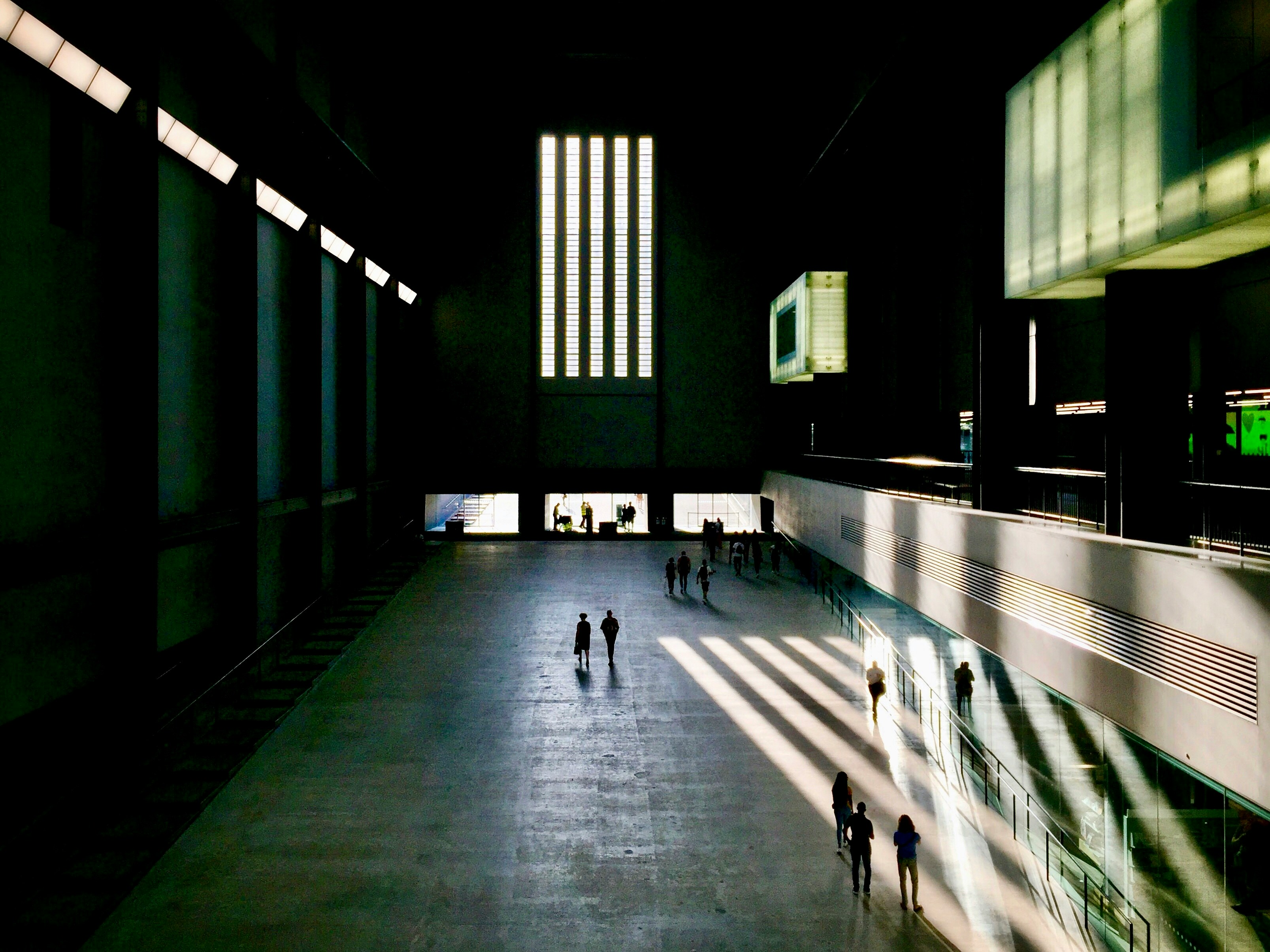 people walking in a large building