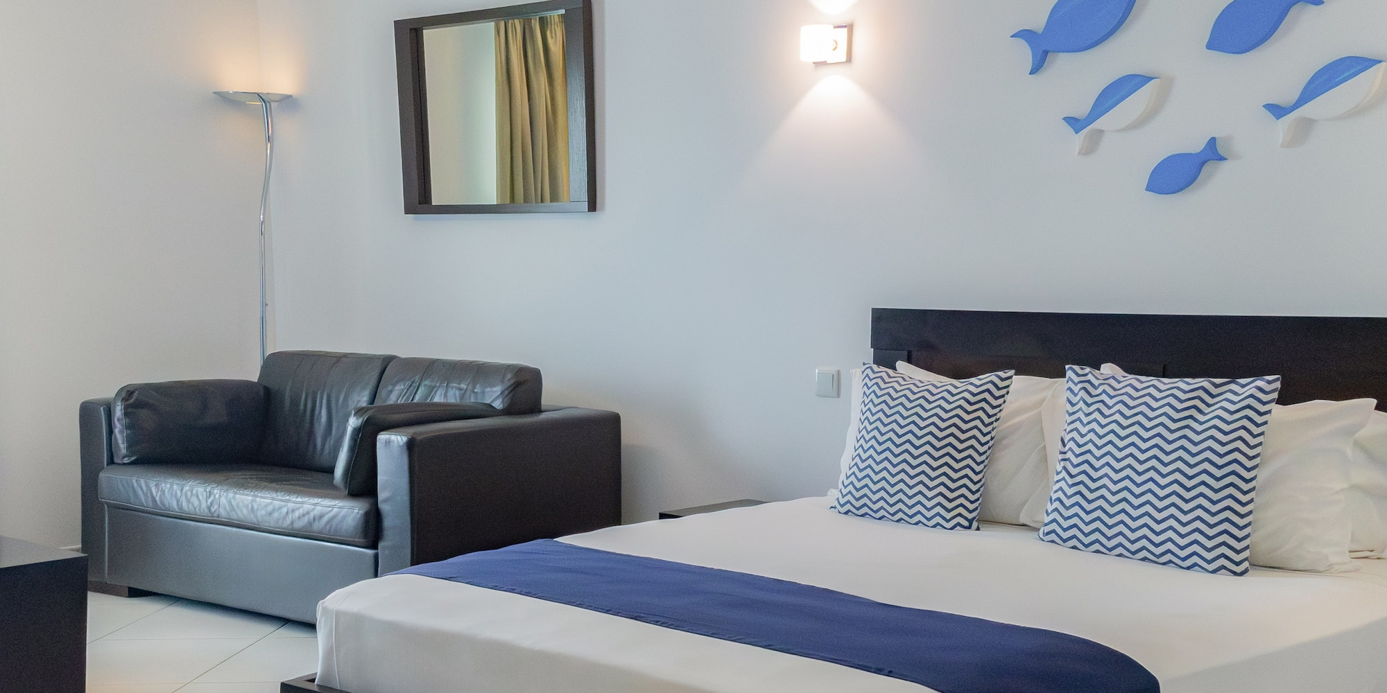 a bed and a couch in a room