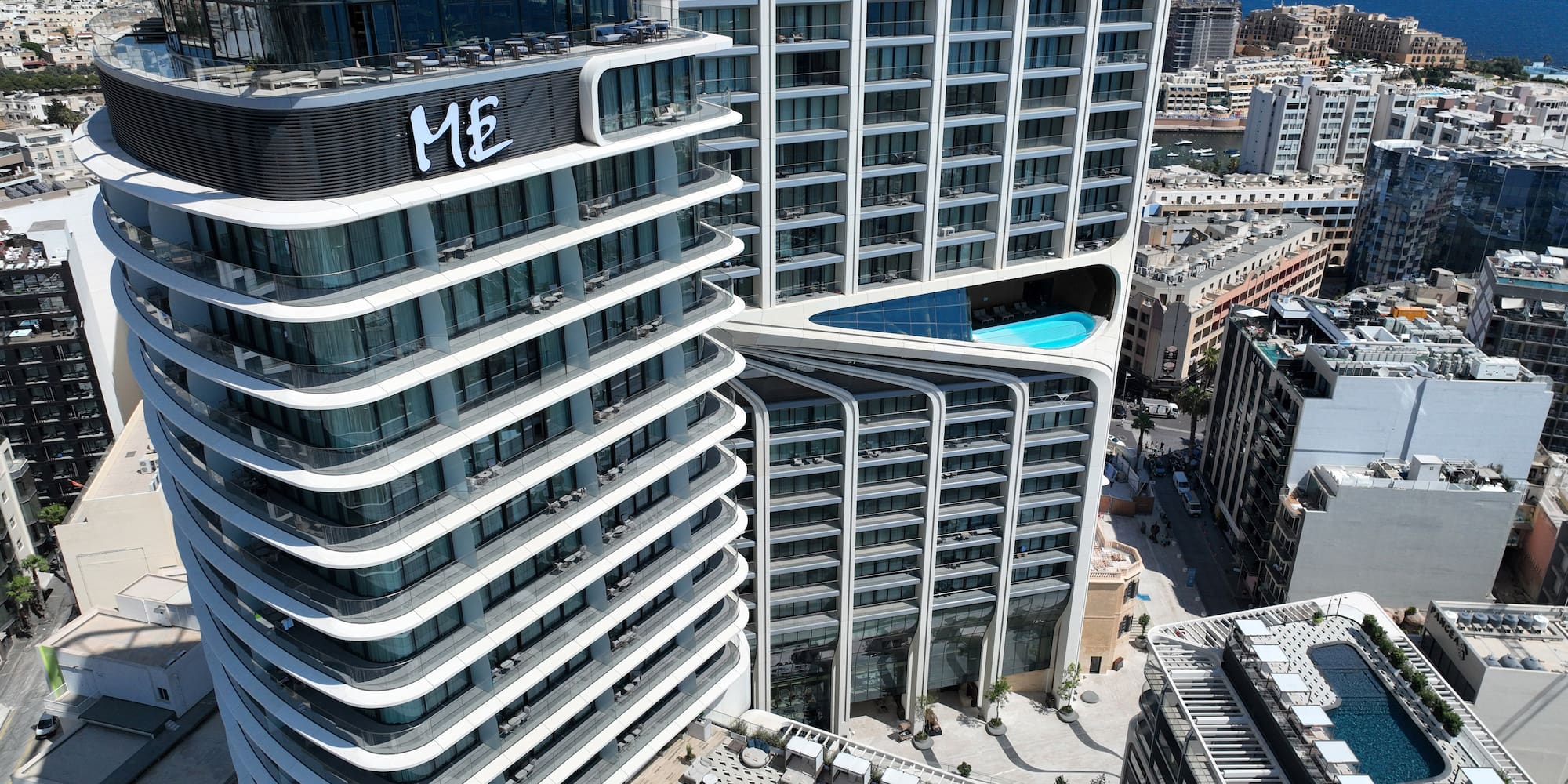 a high rise buildings with a pool in the middle