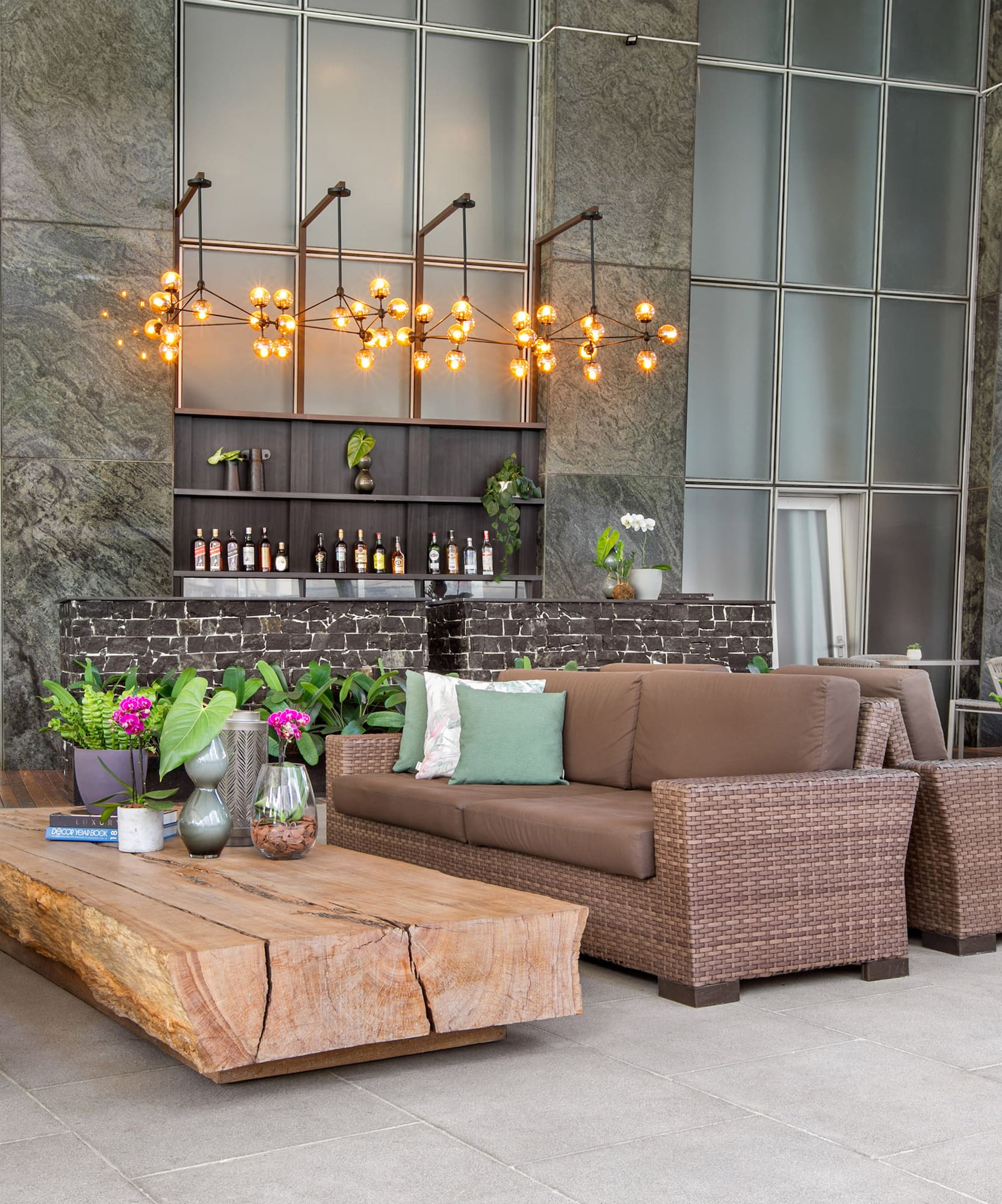 a patio with furniture and a bar