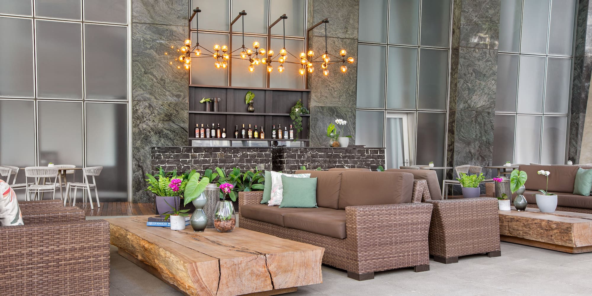 a patio with furniture and a bar