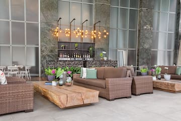 a patio with furniture and a bar