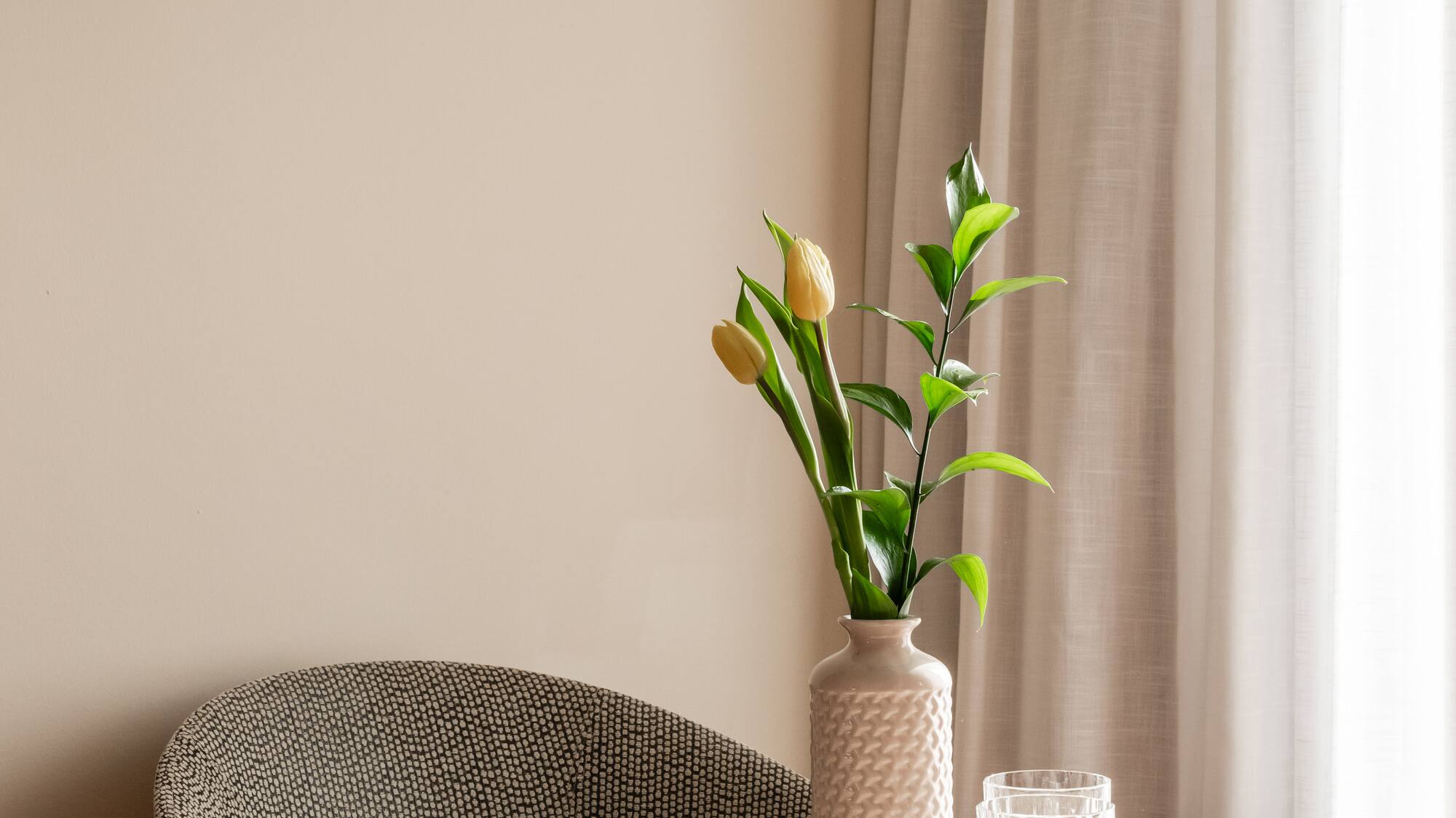 a vase with flowers on a table