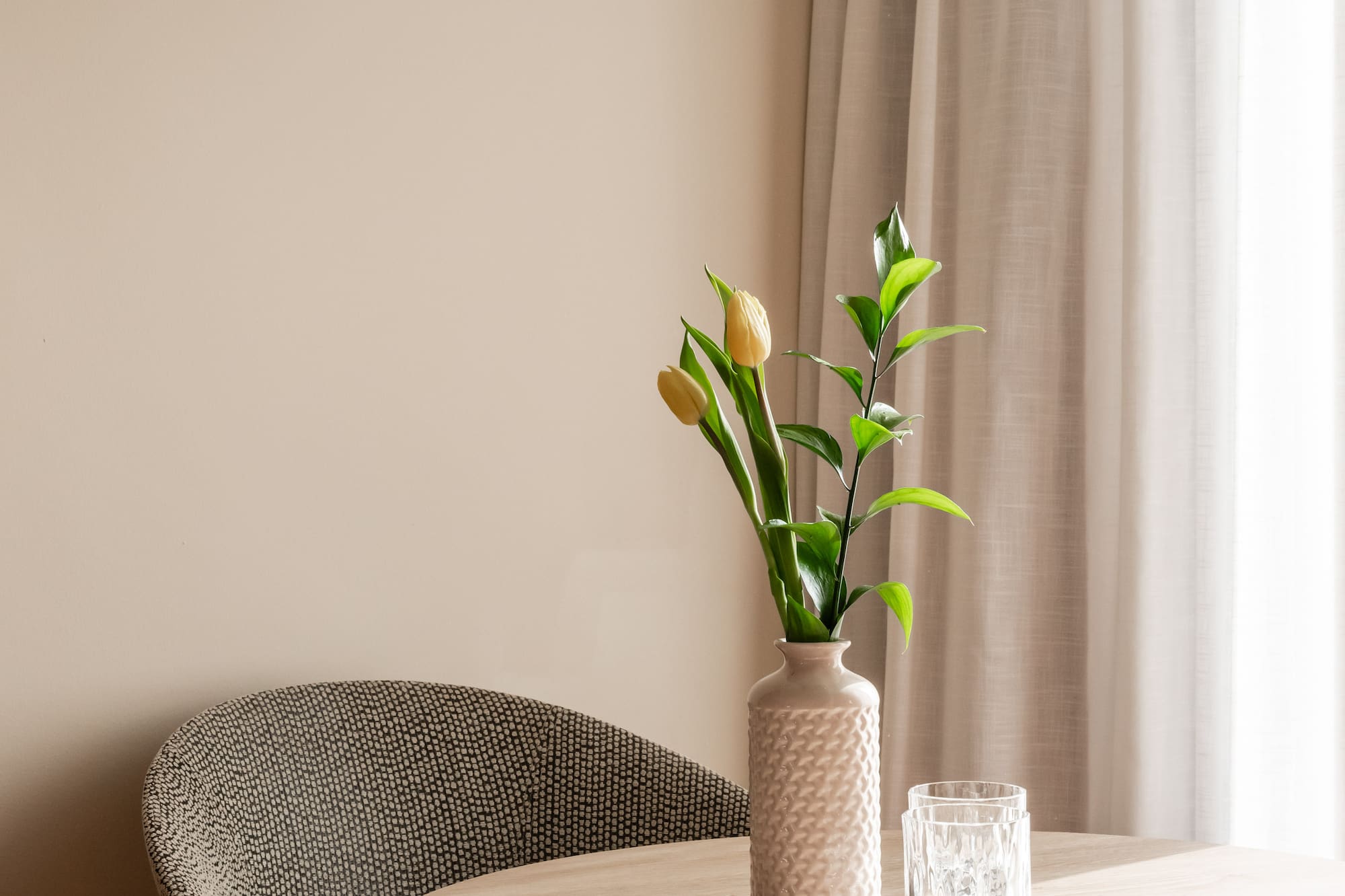 a vase with flowers on a table
