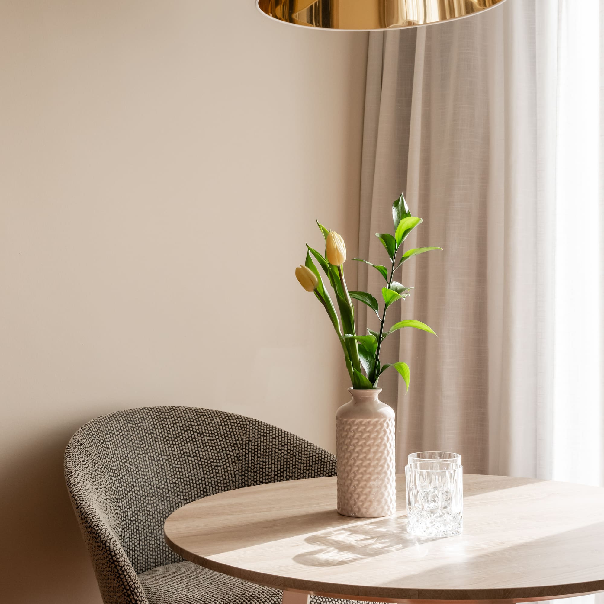a vase with flowers on a table