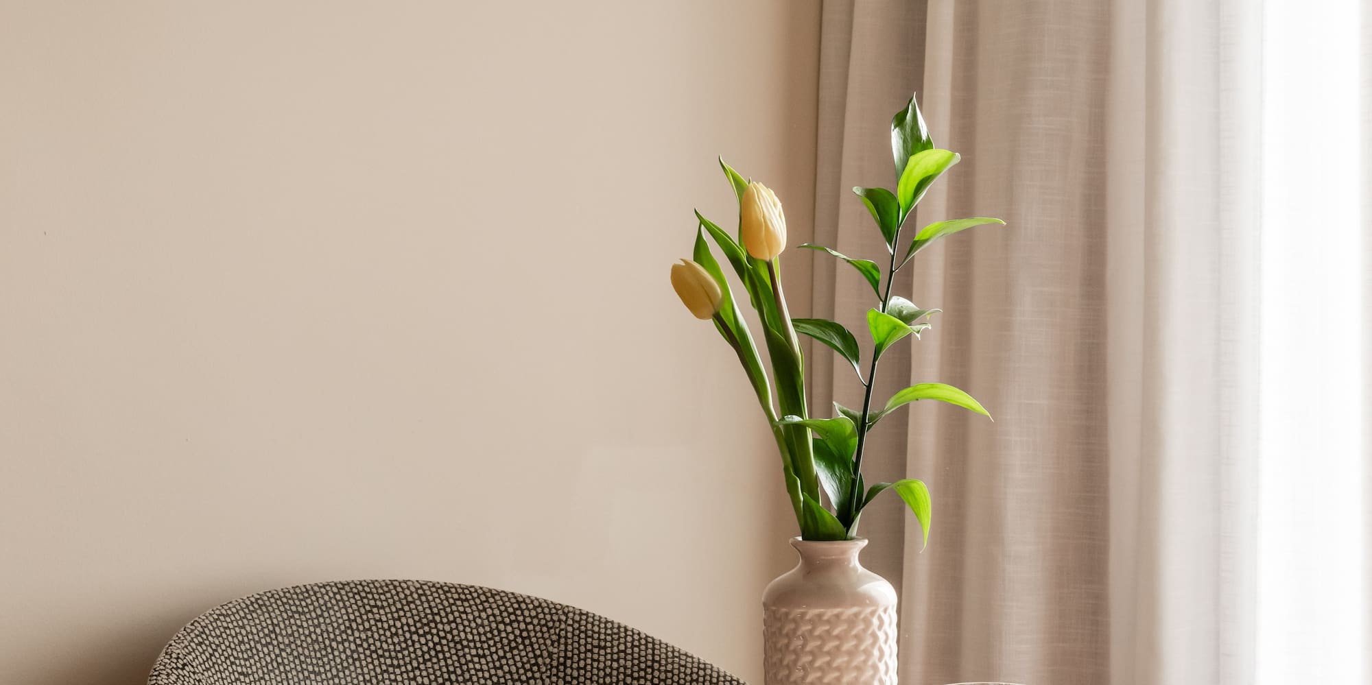 a vase with flowers on a table