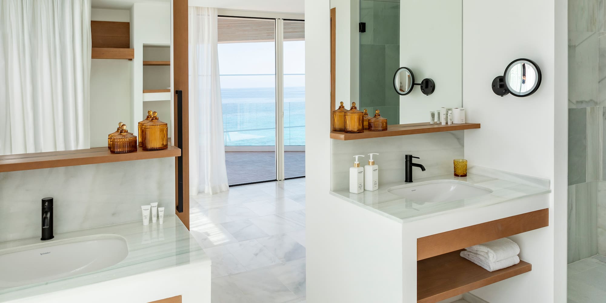 a bathroom with a large mirror and a sink