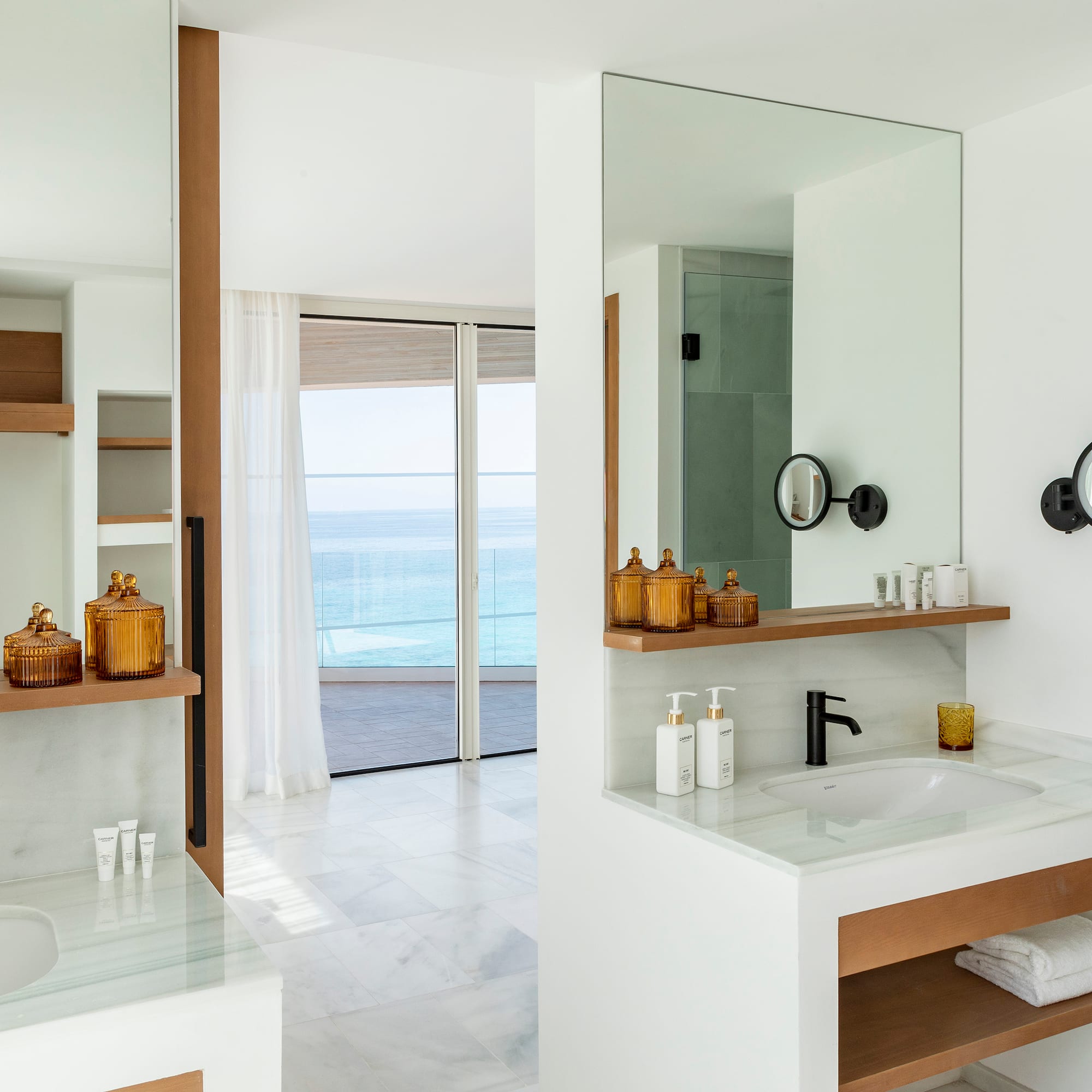 a bathroom with a large mirror and a sink