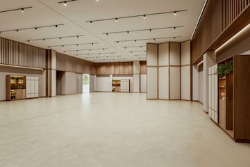 a large room with white walls and wooden ceiling