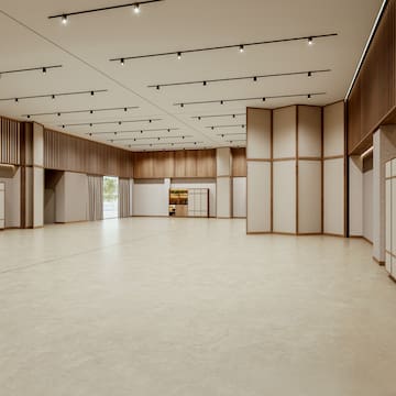 a large room with white walls and wooden ceiling