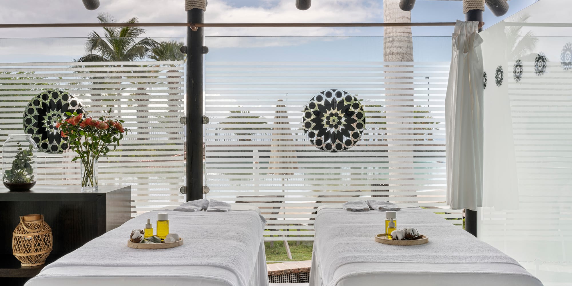 a massage tables with white sheets on it