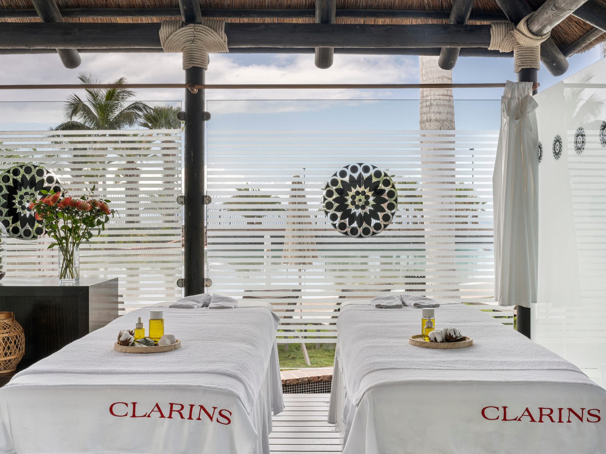 a massage tables with white sheets on it