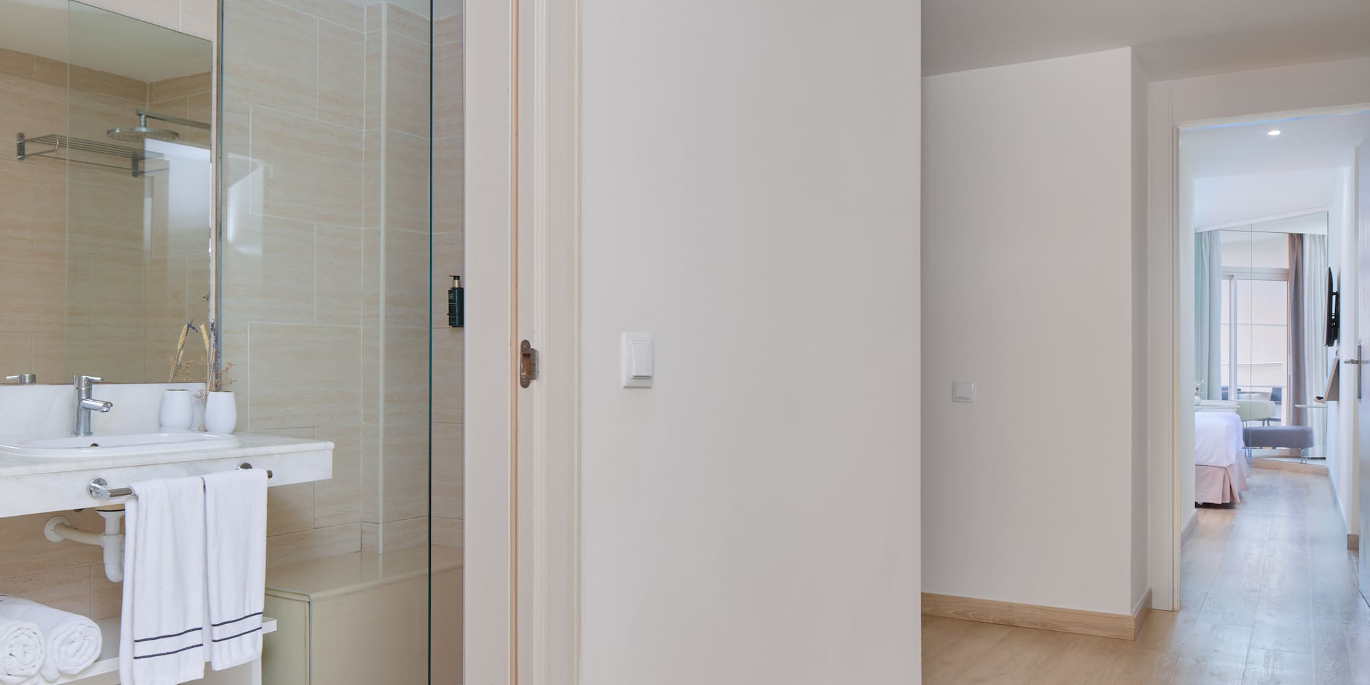 a bathroom with a glass shower door