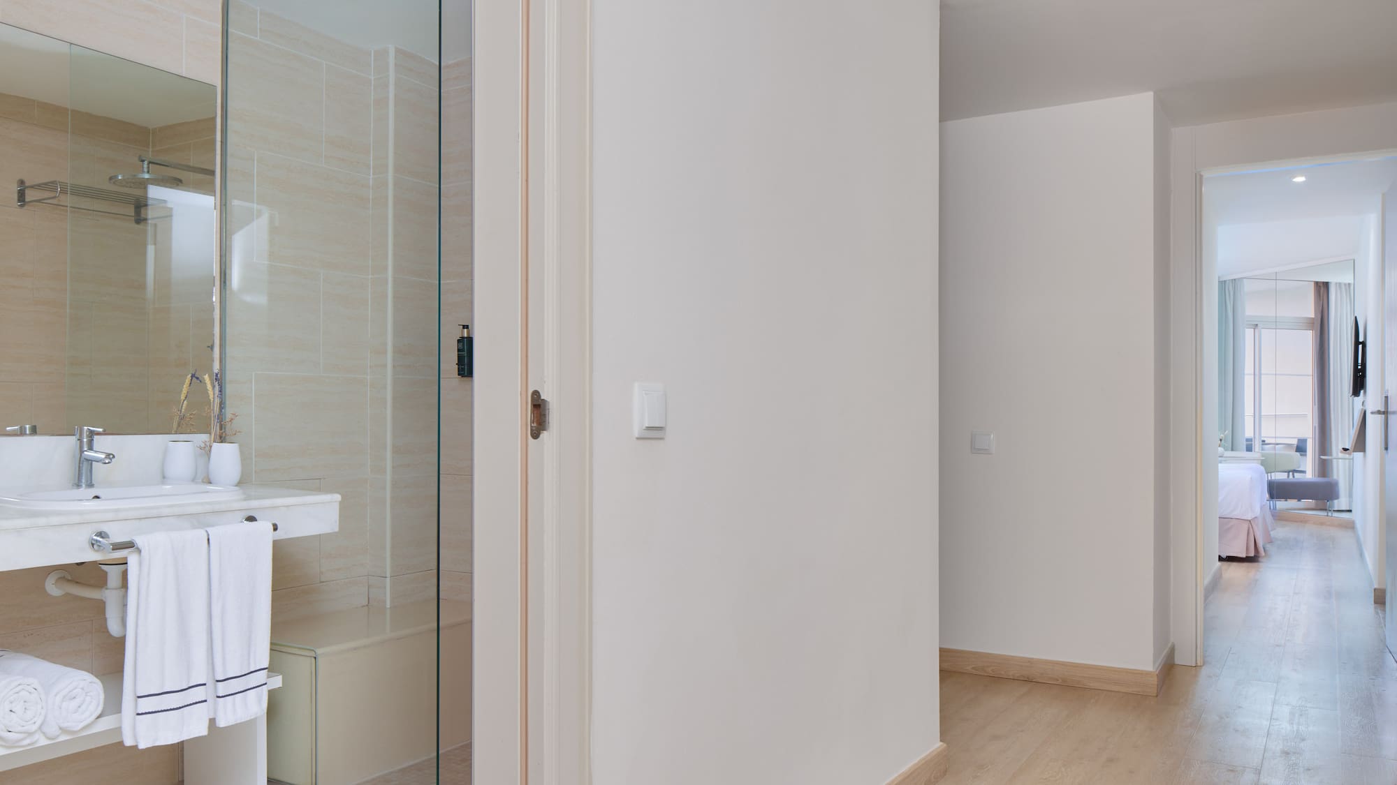 a bathroom with a glass shower door