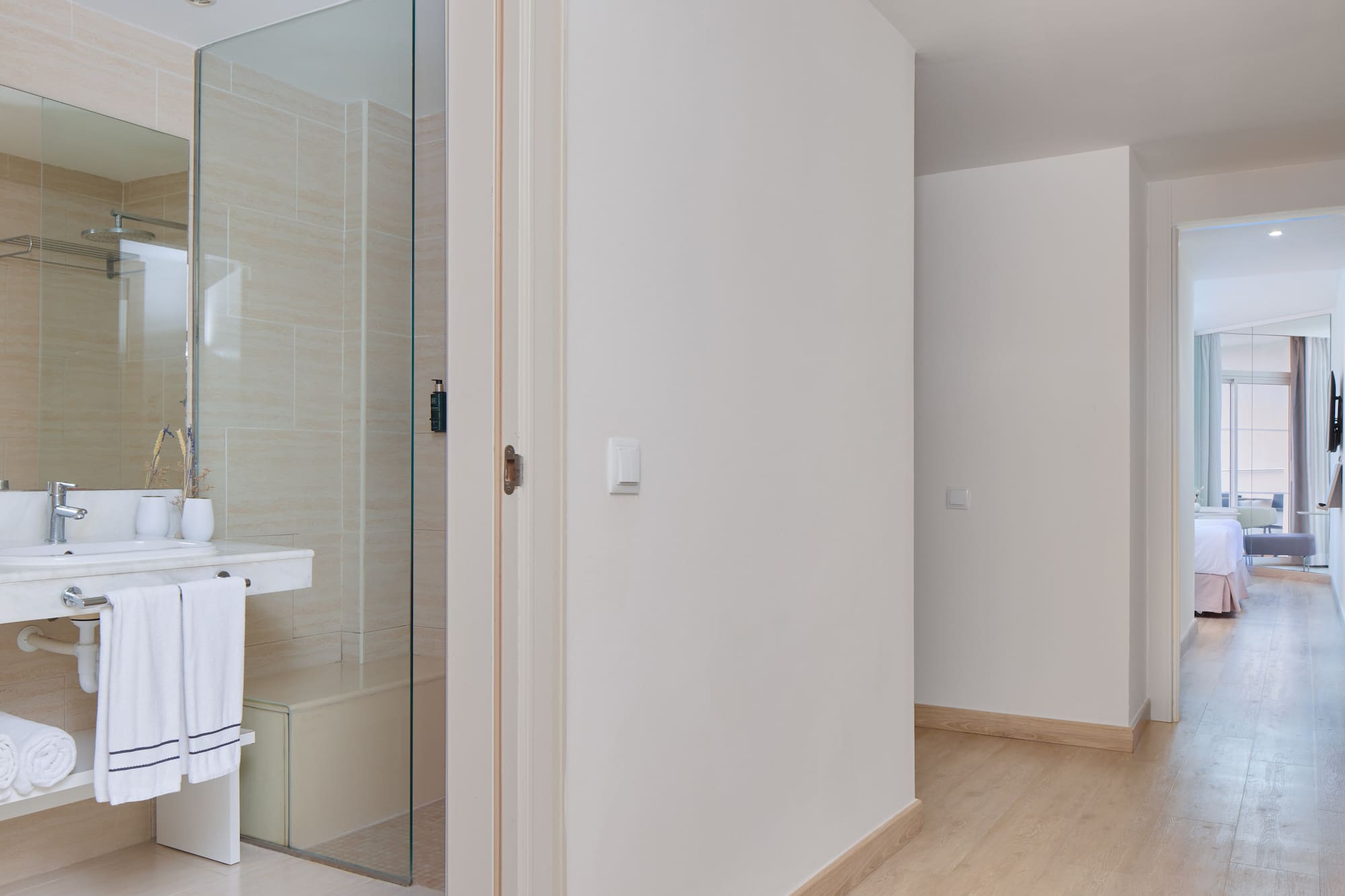 a bathroom with a glass shower door