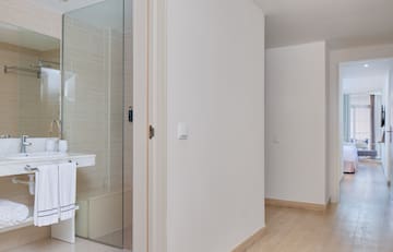 a bathroom with a glass shower door