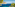 boats in the water with trees and a cliff