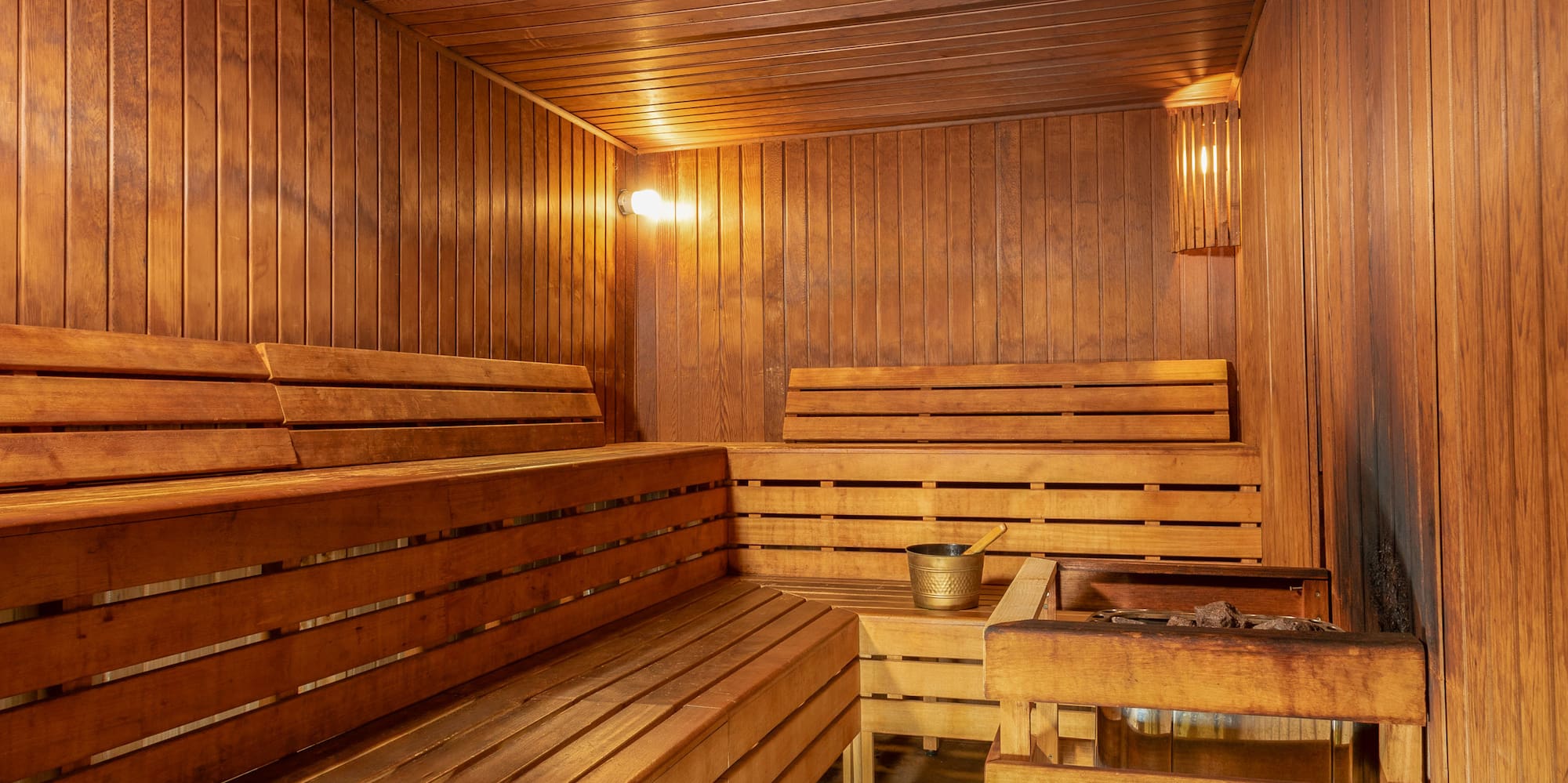 a wooden sauna with a bucket and bucket